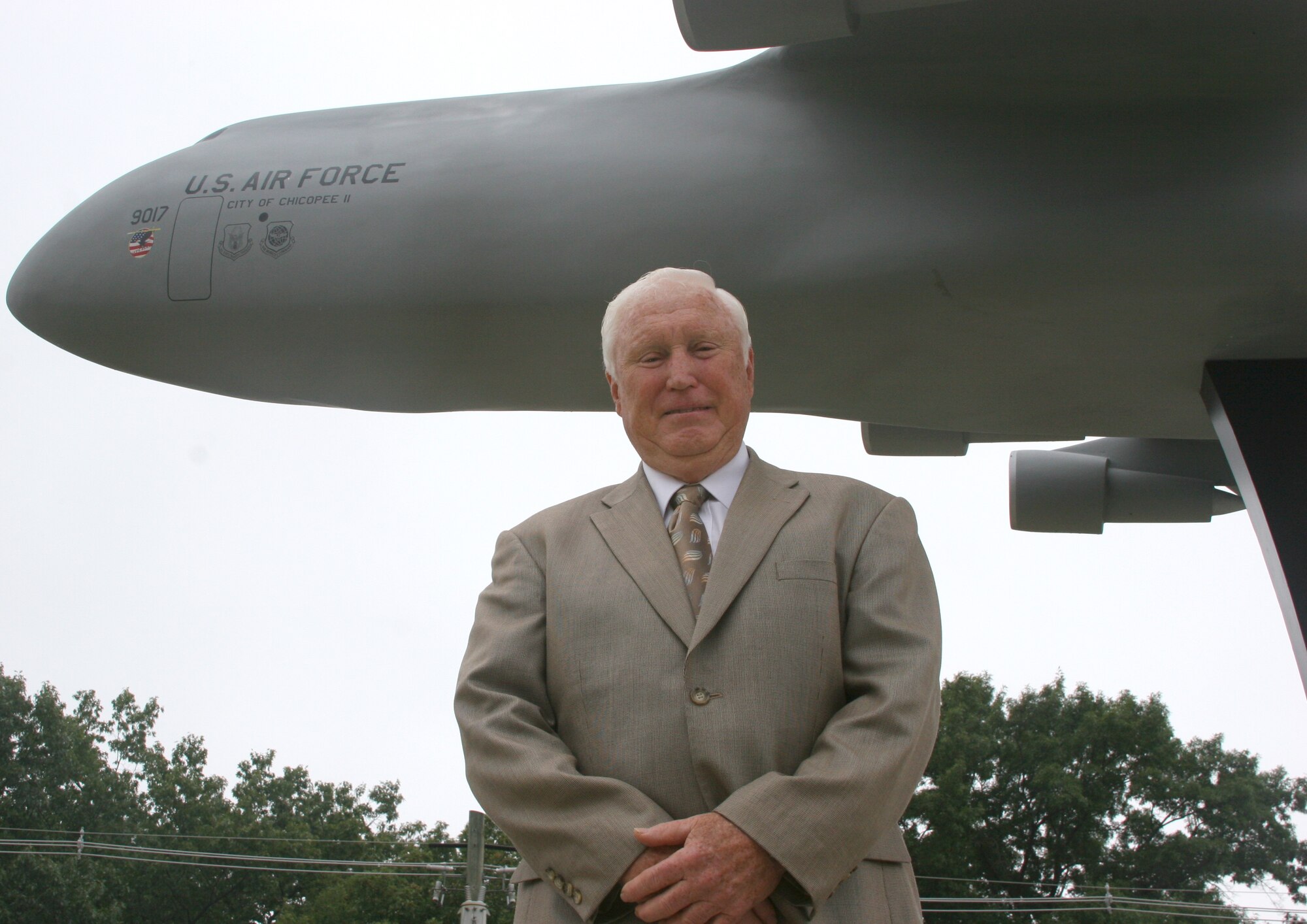 Retired Brig. Gen. Frederick ?Mike? Walker,? former 439th Airlift Wing commander, stands next to the C-5 model near the front gate. General Walker, who led the wing during the C-5 conversion in 1987, visited the base on the A UTA and delivered his remarks at the unveiling of the model, which is among five installed on the base depicting famous military aircraft assigned to Westover. The other aircraft models are a B-52D, KC-135A, C-130E, and a C-123K. (US Air Force photo/Tech. Sgt. Robert Cirillo)