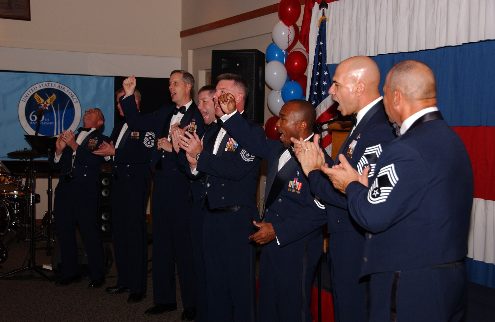 EIELSON AIR FORCE BASE, Alaska -- Eielson's chief master sergeants lead Gala attendees in a rousing rendition of the service's official song "The U.S. Air Force." Originally, the song was known as the 'Army Air Corps Song' the lyrics and music were written in 1939 and the words "U.S. Air Force" have since replaced the original "Army Air Corps". (U.S. Air Force Photo by Airman 1st Class Jonathan Snyder)