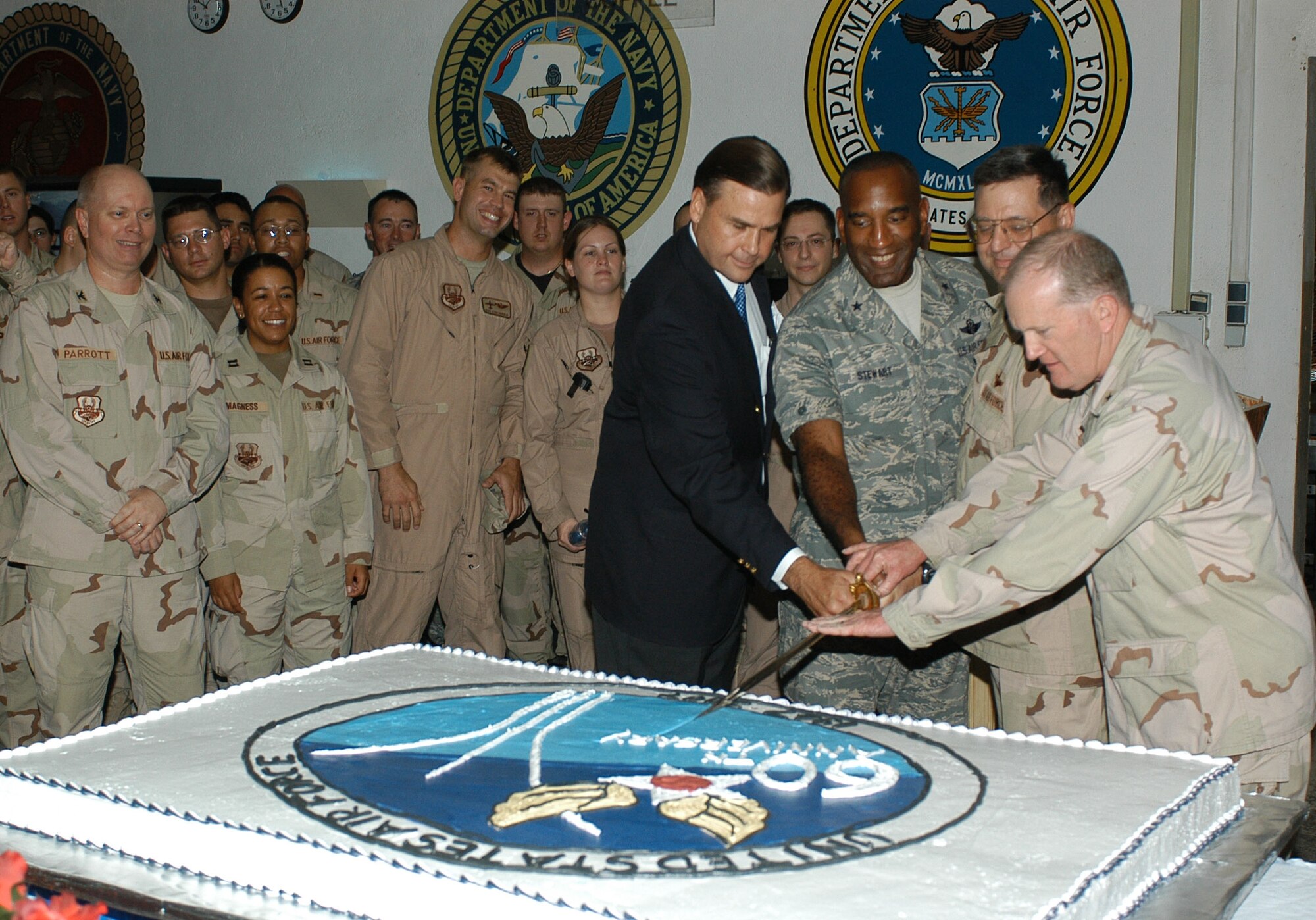 Camp Lemonier, Djibouti - In the joint environment of the camp, right to left, Navy Rear. Adm. James M. Hart assists Col. John M. Crocker, Brig. Gen. Alfred J. Stewart and Ambassador W. Stuart Symington in cutting the cake to celebrate the Heritage to Horizons theme of the Air Force's 60th birthday. Hart is the Combined Joint Task Force - Horn of Africa commander, Crocker is the 449th Air Expeditionary Group commander and Air Component Coordination Element director, Stewart is the Central Command director of mobility forces and Symington is the United States Ambassador to Djibouti and grandson of the first Secretary of the Air Force W. Stuart Symington III.  (U.S. Air Force/Staff Sgt. Jennifer Redente)