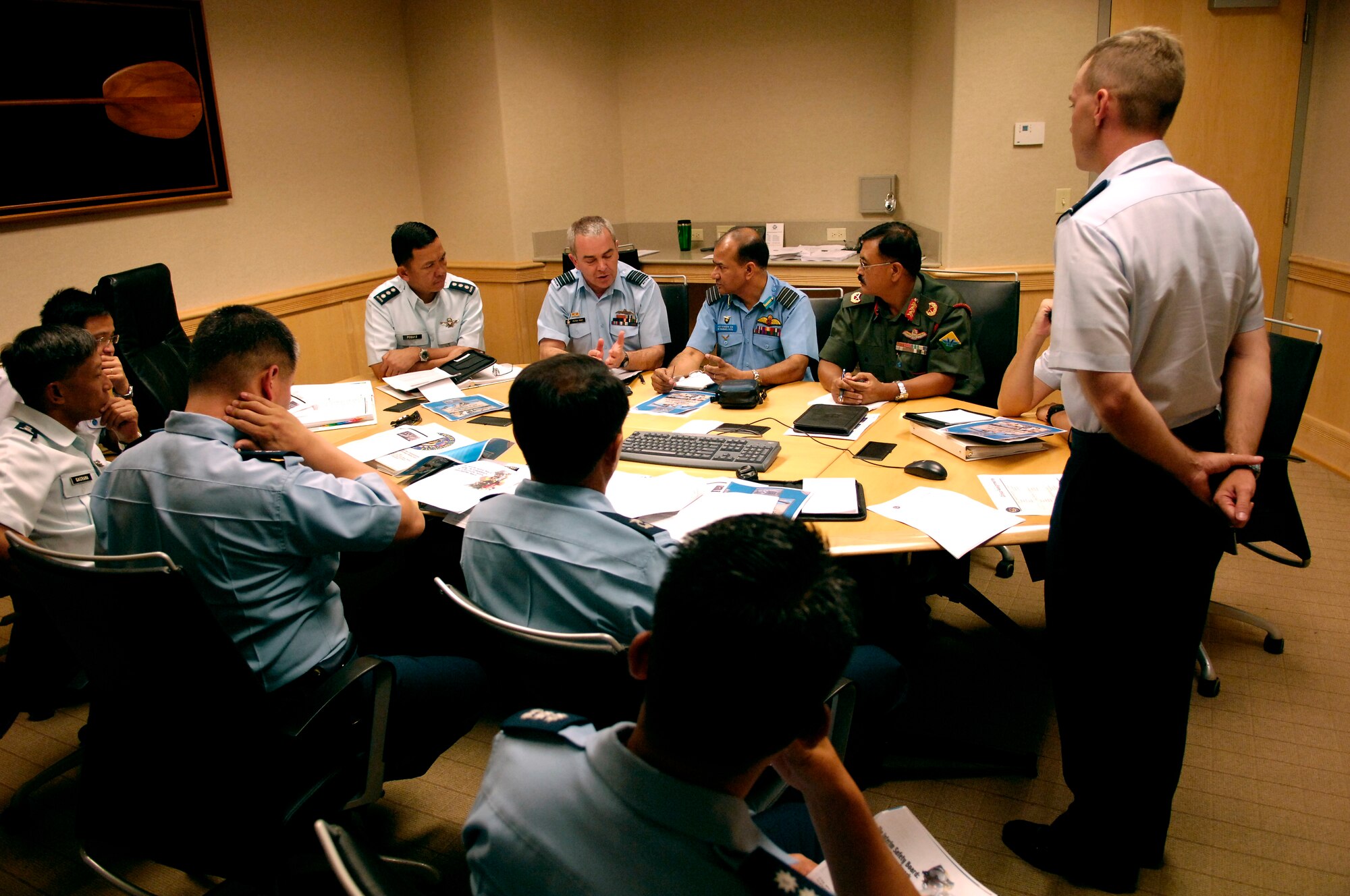 Members of the Pacific Rim Airpower Symposium discuss mishap investigation procedures Sept. 19, 2007 during a break out session at the Aloha Conference Center on Hickam Air Force Base, Hawaii. The PACRIM Symposium provides an ideal forum to communicate the value of U.S. engagement with nations of the Asia-Pacific region and our commitment to the region to internal, local, national and regional audiences. (U.S. Air Force photo/Tech. Sgt. Shane A. Cuomo)