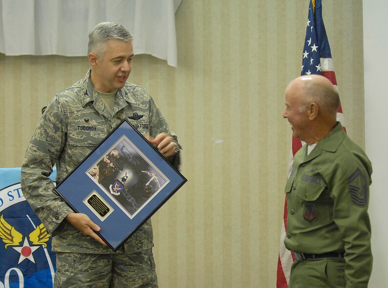 Col. Kenneth Todorov, 23rd Wing commander, presents guest speaker Chief Master Sgt. (retired) Earl Hendrix a plaque during Moody’s 60th Air Force Anniversary celebration Sept. 18 at the Moody Field Club. (U.S. Air Force Photo by Staff Sergeant Manuel J. Martinez) 
