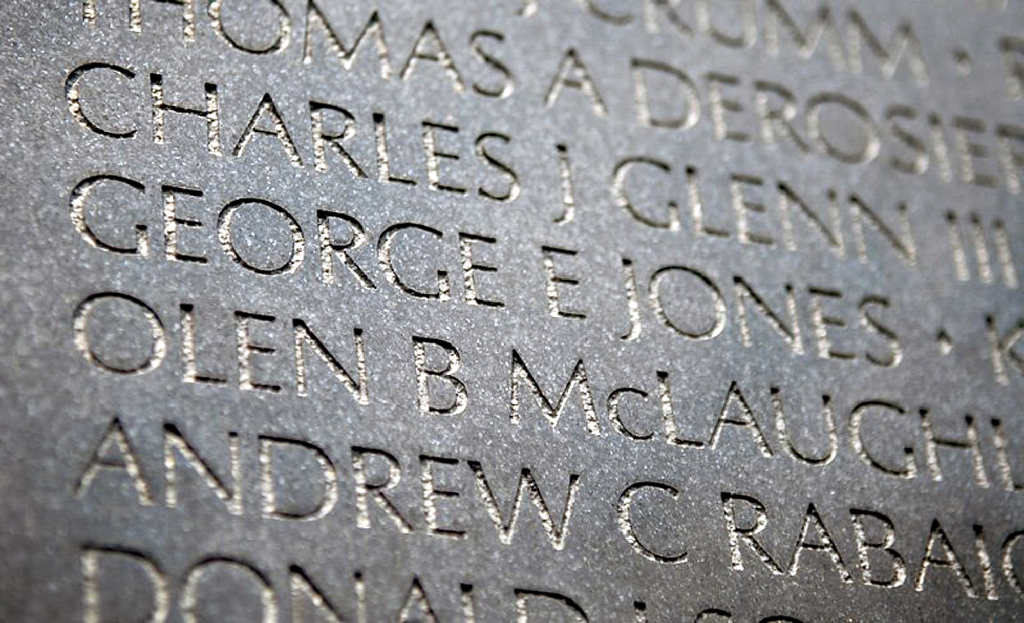 Staff Sgt. Gary Ritter, along with wife, Kristina, and daughter, Cheyenne, visit the gravesite of 1st Lt. George Jones of Aberdeen, Miss., May 28 at Arlington National Cemetery. Sergeant Ritter made the journey to Arlington to meet with the family of Lieutenant Jones, and to give them the POW/MIA bracelet baring the Lieutenant's name that he had kept for 19 years. He gave the bracelet to the youngest daughter of Lieutenant Jones on Memorial Day in honor of his memory. Sergeant Ritter is a combat arms instructor at the Expeditionary Center at Fort Dix, N.J. (U.S. Air Force photo/Christopher Duggan) 