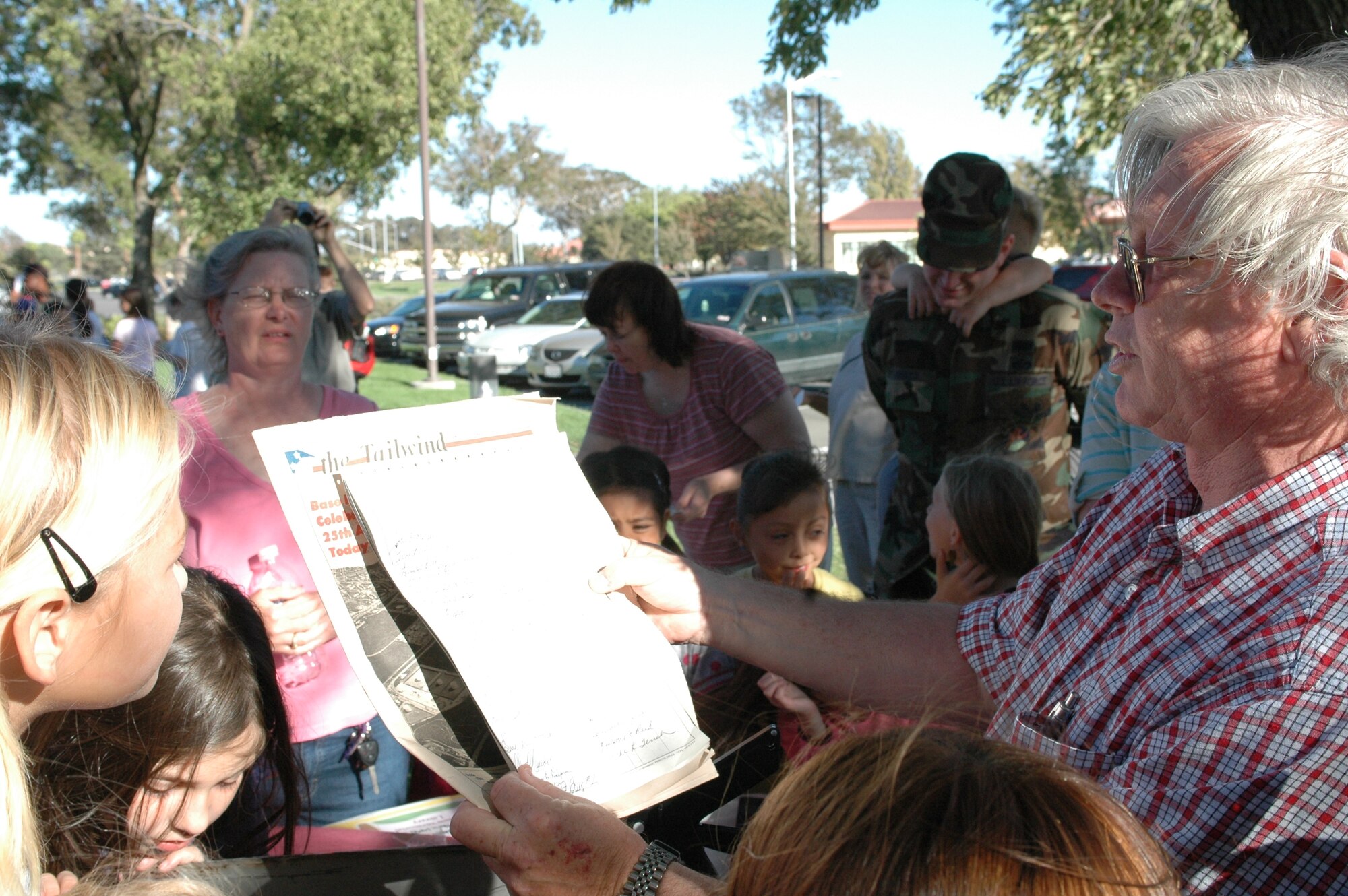 Anthony Gonzales, senior library technician, reads a Tailwind article from 1982 during the 60th Air Force Birthday Celebration at the Mitchell Memorial Library Sept. 18. During the event, library staff opened a 25-year-old time capsule containing various items donated from agencies around the base during the year of 1982. (U.S. Air Force photo/Staff Sgt. Matthew McGovern) 