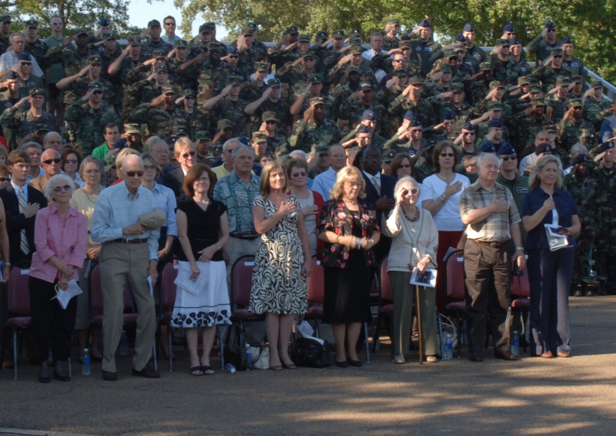 Several hundred Columbus AFB Airmen and guests pay tribute during  the POW/MIA retreat ceremony Wednesday.  The ceremony was part of the base's 60/65 heritage celebration. (U.S. Air Force photo by Airman 1st Class Danielle Powell)
