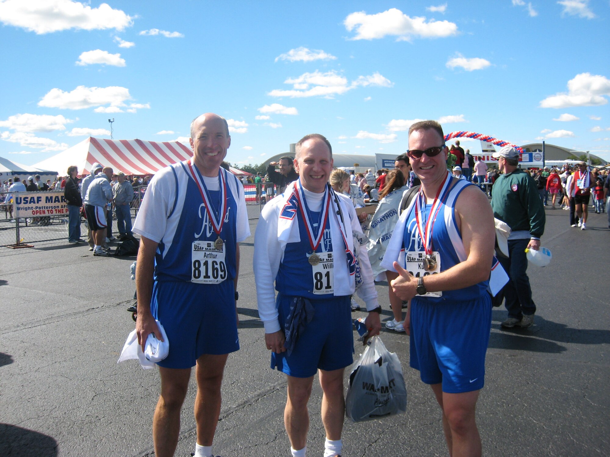 From left to right, AEDC Commander Col. Art Huber, 716th Test Squadron Commander Lt. Col. William Hack, and Maj. Kurt Rouser show off their medallions after finishing 9th out of 40 teams in the military relay category with a time of 3:25:22. 704th Test Group Commander Col. James Jolliffe is not pictured.
