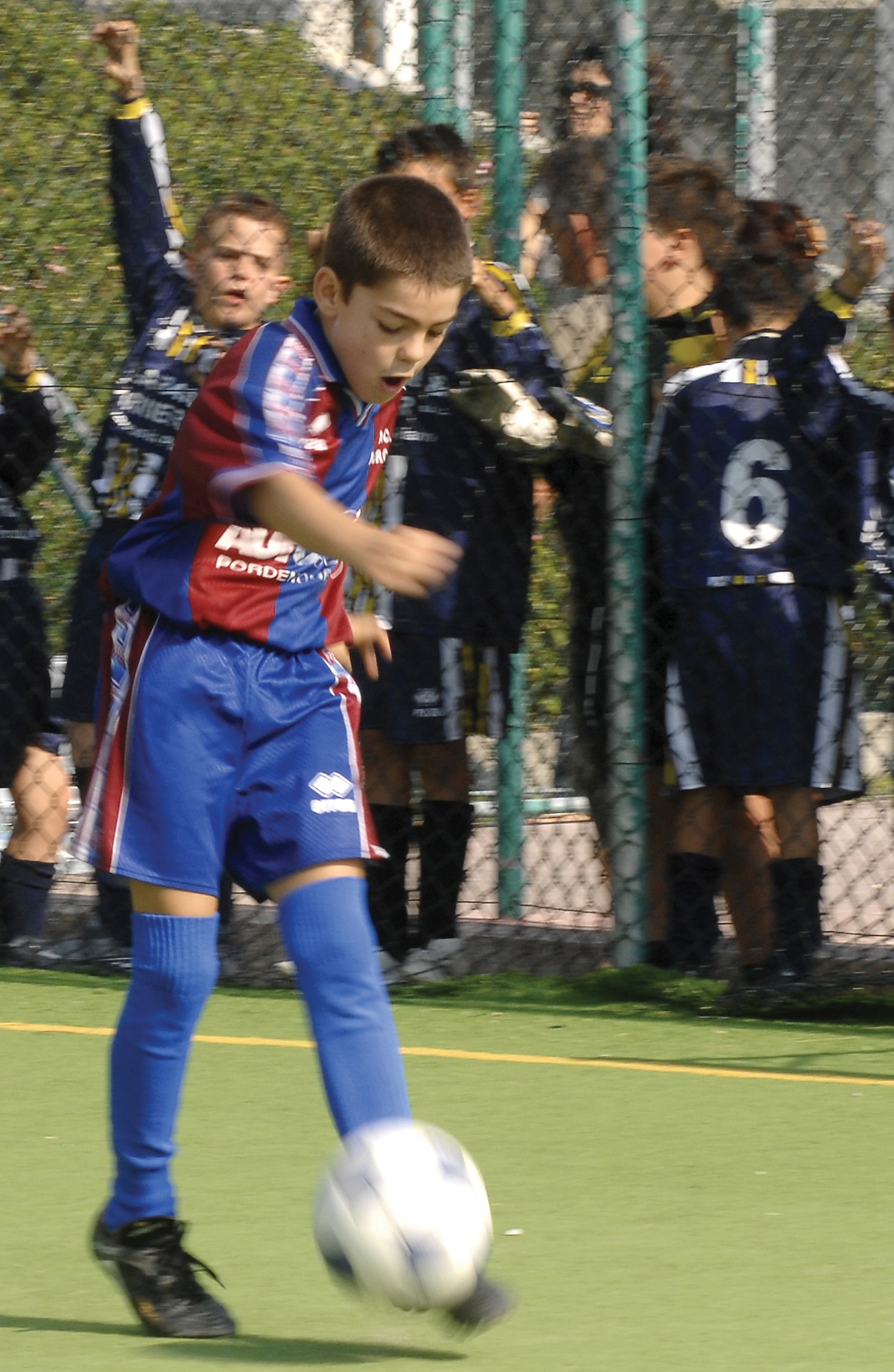 AVIANO AIR BASE, Italy--Davide De Carvalho fires the ball to a teammate during a soccer match Sunday. The annual festival is held to promote friendship between the American and Italian communities and allows them the opportunity to meet and get to know each other. 
(U.S. Air Force photo by Airman 1st Class Liliana Moreno)  (Released)