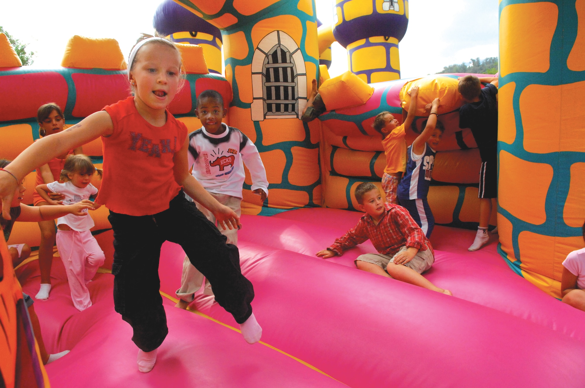 AVIANO AIR BASE, Italy--Children from Aviano Air Base and the Italian community play inside a bouncy castle Sept. 13. This year?s events included a bike tour, basketball, volleyball, horseback riding, archery, bouncing castles for children, horseshoes, local art, and a soccer tournament. 
(U.S. Air Force photo by Staff Sgt. Michael Holzworth).