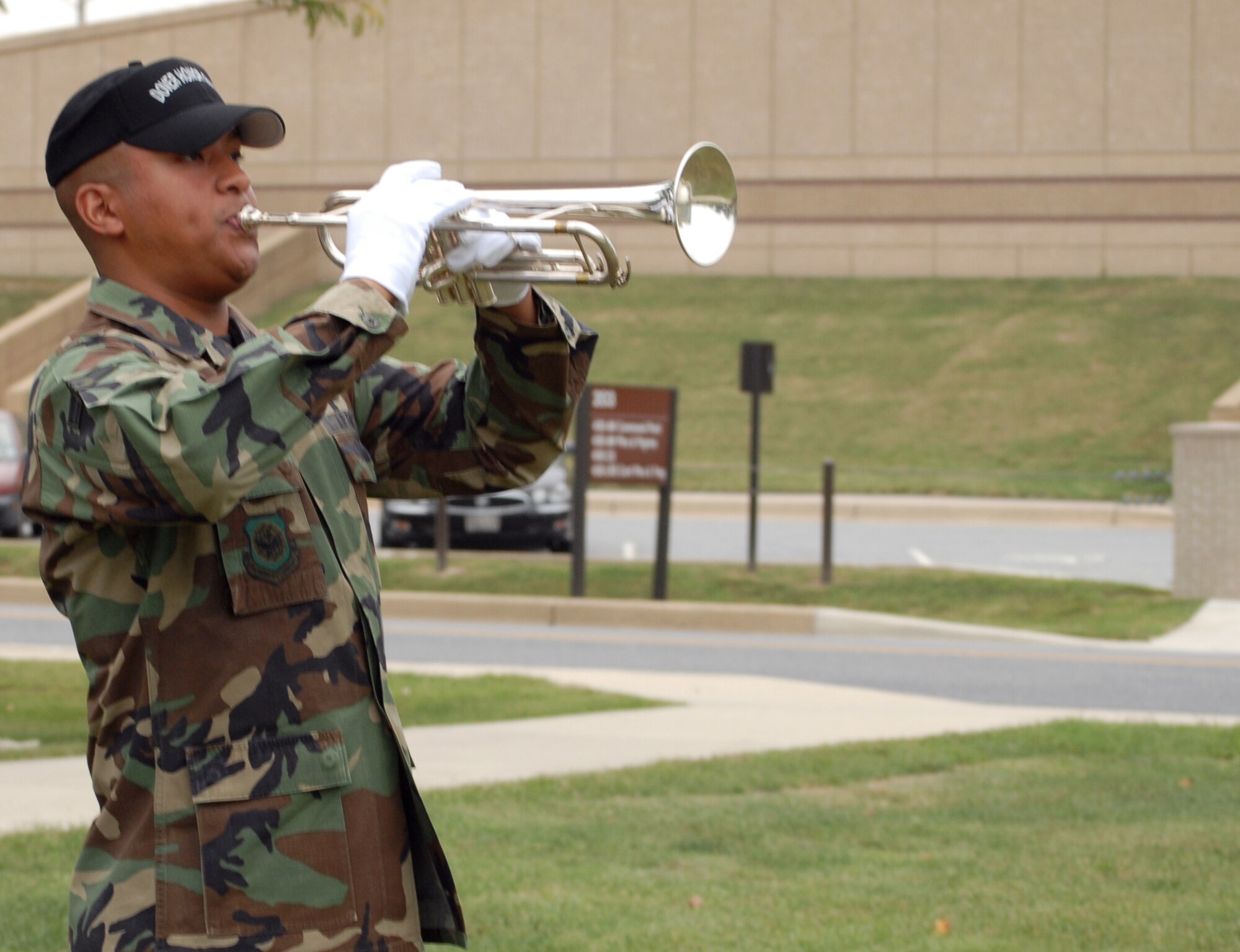 Team Dover hosted a ceremonial remembrance of America's prisoners of war and those missing in action  Sept. 14. Once commanded to do so, Airman 1st Class Tony Boyd, Team Dover honor guard member, sounded retreat on a bugle. The day ended in a POW/MIA remembrance and retreat ceremony. (U.S. Air Force photo/Tech. Sgt. Kevin Wallace)