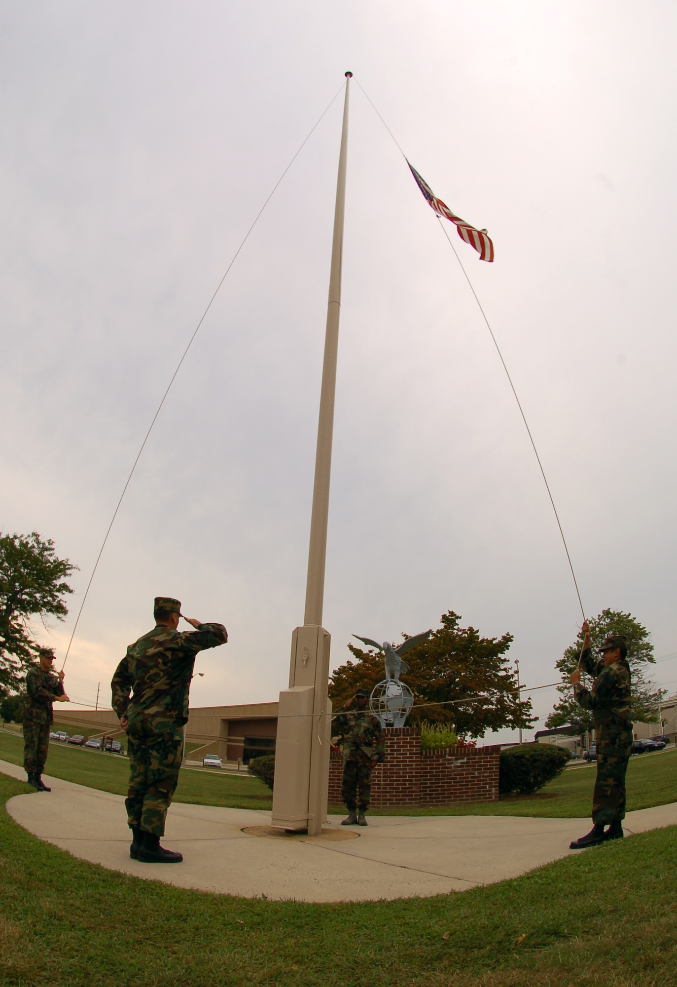 From reveille to retreat, teams of four Airmen took turns standing guard of 'Old Glory.' (U.S. Air Force photo/Tech. Sgt. Kevin Wallace)