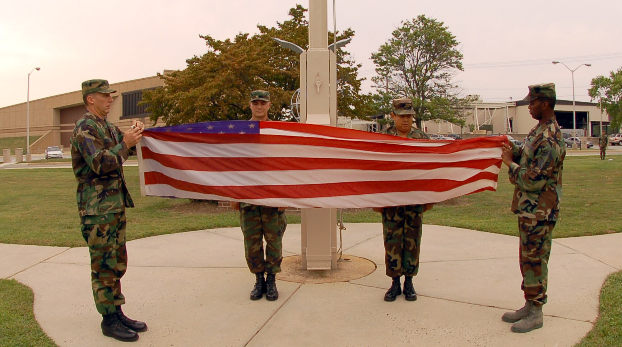 The day’s ceremony concluded with a team of Dover Air Force Base Airmen securing the colors. (U.S. Air Force photo/Tech. Sgt. Kevin Wallace)