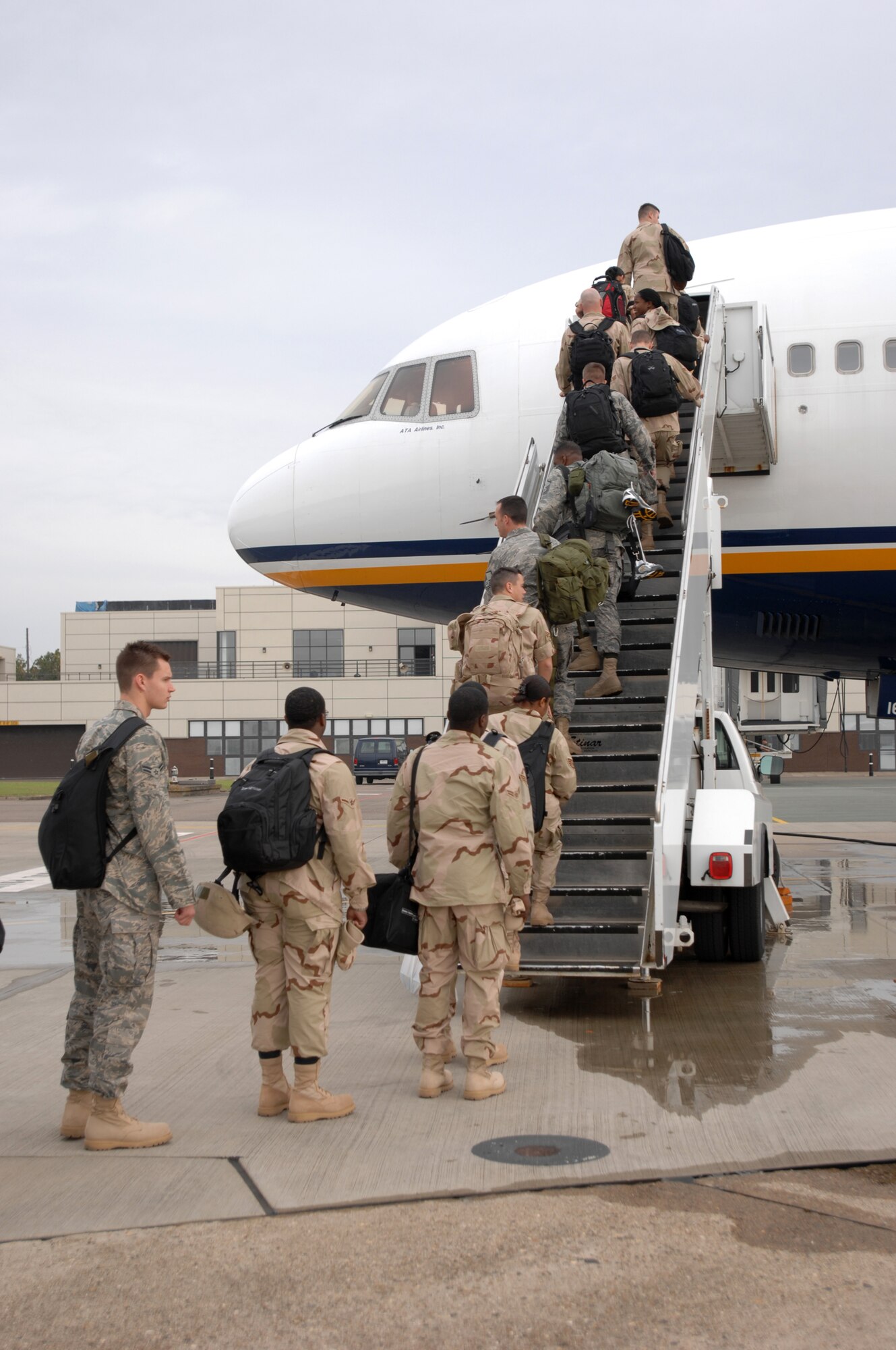 Nearly 100 RAF Mildenhall deployers board an Air Mobility Command aircraft going to various deployed locations, Sept. 14, 2007.. (U.S. Air Force photo by Tech. Sgt. Tracy L. DeMarco)
