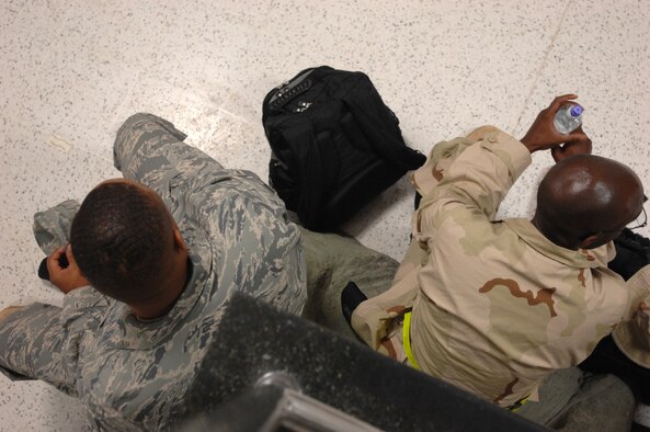 With nearly 100 deployers waiting to depart RAF Mildenhall, Sept. 14, 2007, it was clear that the Air Force is slowly making the transition to the new Airman battle uniform. Since ABUs are only authorized for certain downrange locations, not every deployer was issued them prior to departure. Those Airmen will wear the desert combat uniform. (U.S. Air Force photo by Tech. Sgt. Tracy L. DeMarco)
