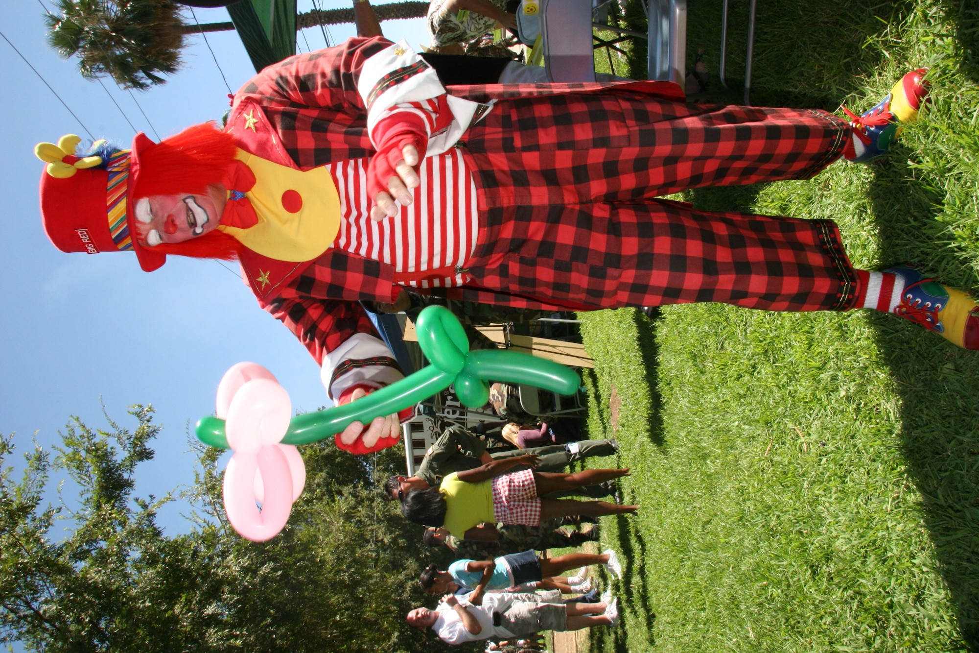 Children constantly waited in line for their turn with a group of clowns, some of whom made balloon animals and others painted faces, for March Field's annual family picnic. (U.S. Air Force photo by Senior Airman Paul Duquette)