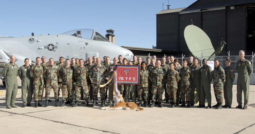 Current and former members of the 76th Space Control Squadron at Peterson Air Force Base, Colo., gathered to bid farewell to part of its heritage as officials transfer the squadron's share of the historic Flying Tigers heritage to the newly created 76th Fighter Squadron from Moody AFB, Ga.  The 76th FS joins the 74th FS and 75th FS as part of the 23rd Fighter Wing for the first time since World War II.  (U.S. Air Force photo/Roberta McDonald)
