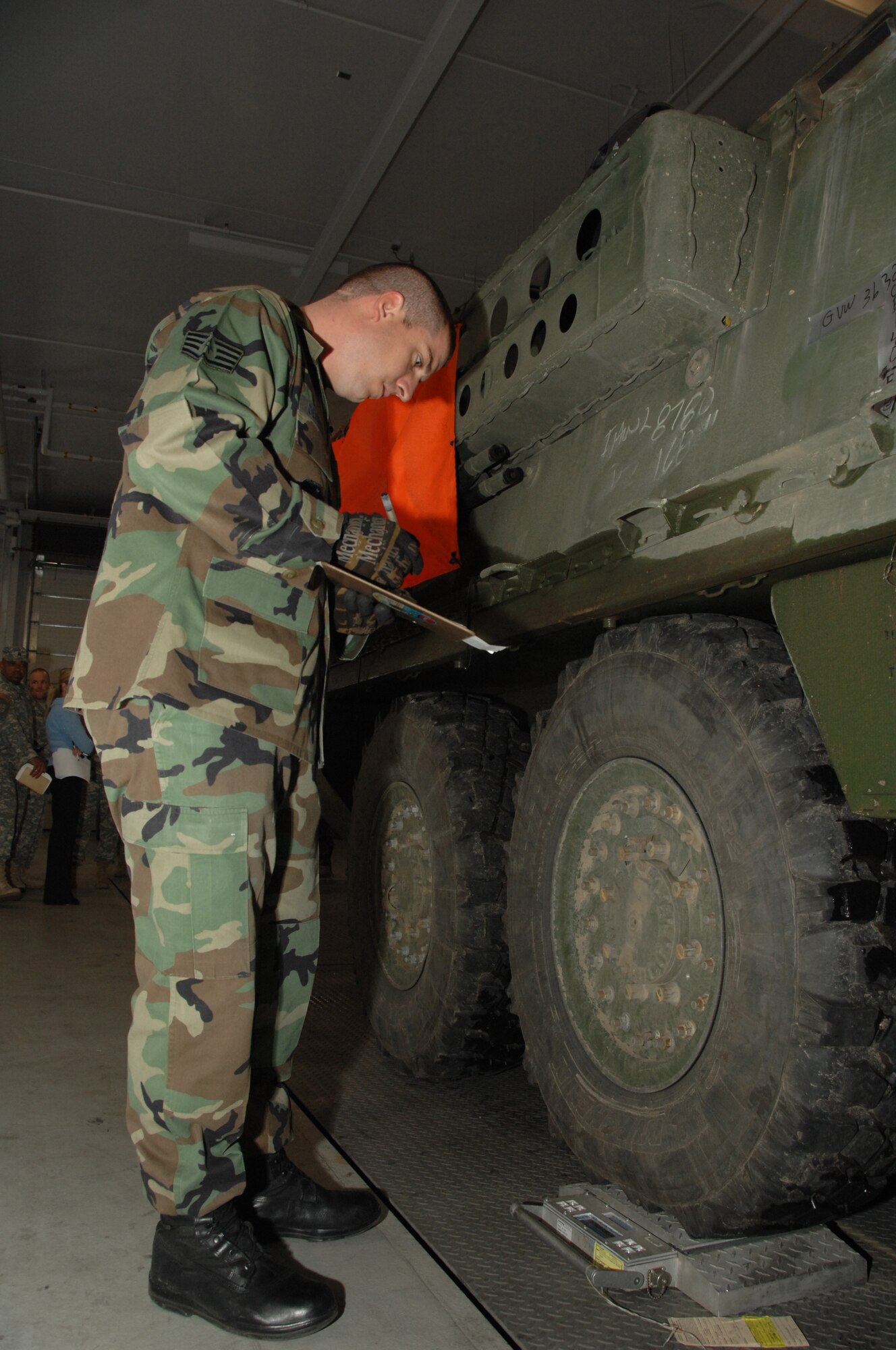 EIELSON AIR FORCE BASE, Alaska -- Staff Sgt. Brad DeVinney, 354th Logistic Readiness Squadron, calculates the total weight of a Stryker Combat Vehicle Sept. 19, 2007 at the ammunition processing facility adjacent to the Eielson Joint Mobility Complex. Eielson's 354th Logistic Readiness Squadron personnel conducted a joint training event to orientate Stryker personnel on aerial movement preparation of the Stryker Combat Vehicle. This was the first time Icemen and Arctic Wolves teamed up to conduct joint mobility training featuring Eielson as an aerial port of embarkation.   (U.S. Air Force photo by Airman 1st Class Christopher Griffin)