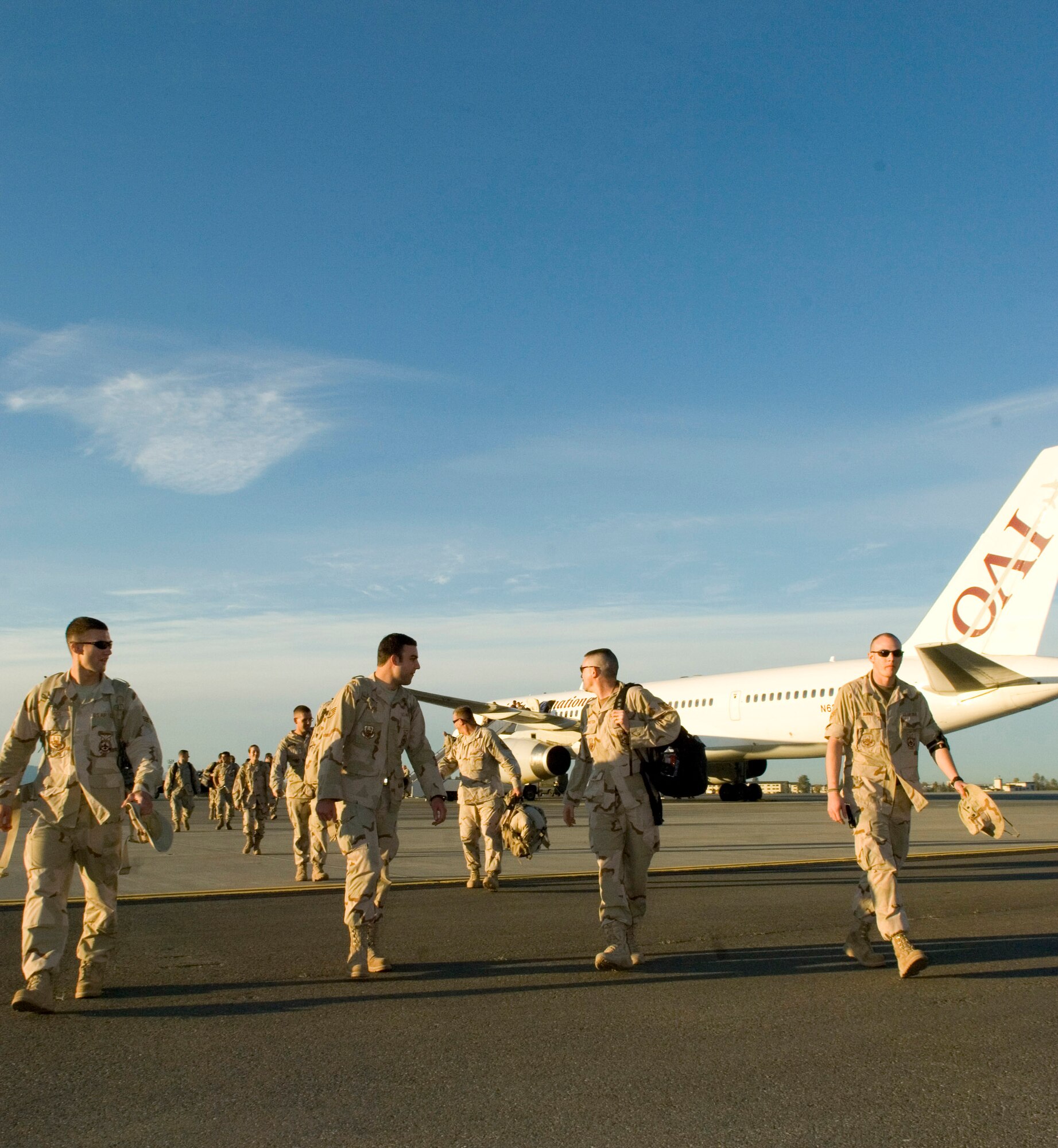 Approximately 40 Airmen disembark from a commercial aircraft Sept. 17 as they return to Elmendorf Air Force Base, Alaska, after being deployed in Southwest Asia supporting the war on terrrorism. The Airmen returned to friends and families awaiting their arrival at the joint military complex. (U.S. Air Force photo/Senior Airman Garrett Hothan)
