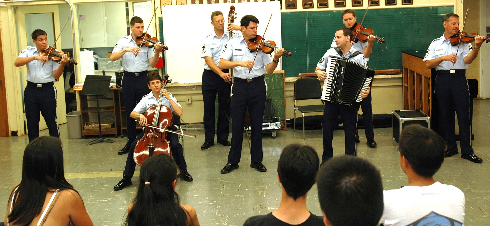 Members of the U.S. Air Force Strolling Strings play a mini-concert for the string orchestra class at Kalani High School in Honolulu Sept. 14 as part of the Air Force?s 60th anniversary celebration during Air Force Week there. (U.S. Air Force Photo/Staff Sgt. Betty J. Squatrito-Martin)