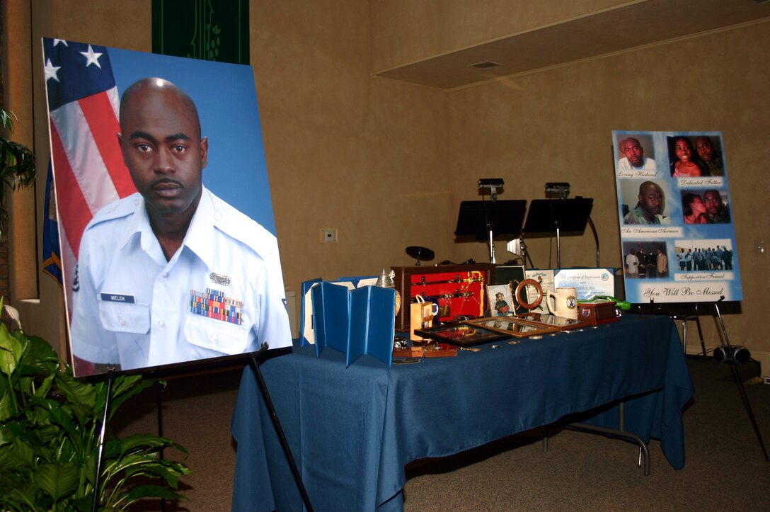 Photographs and personal belongings of 882nd Training Support Squadron Staff Sgt. Charles Welch serve as a tribute to the fallen Airman in a memorial service at the North Chapel Sept. 20.  Sergeant Welch died from injuries sustained in a one-vehicle accident. (U.S. Air Force photo/Staff Sgt. Tonnette Thompson)