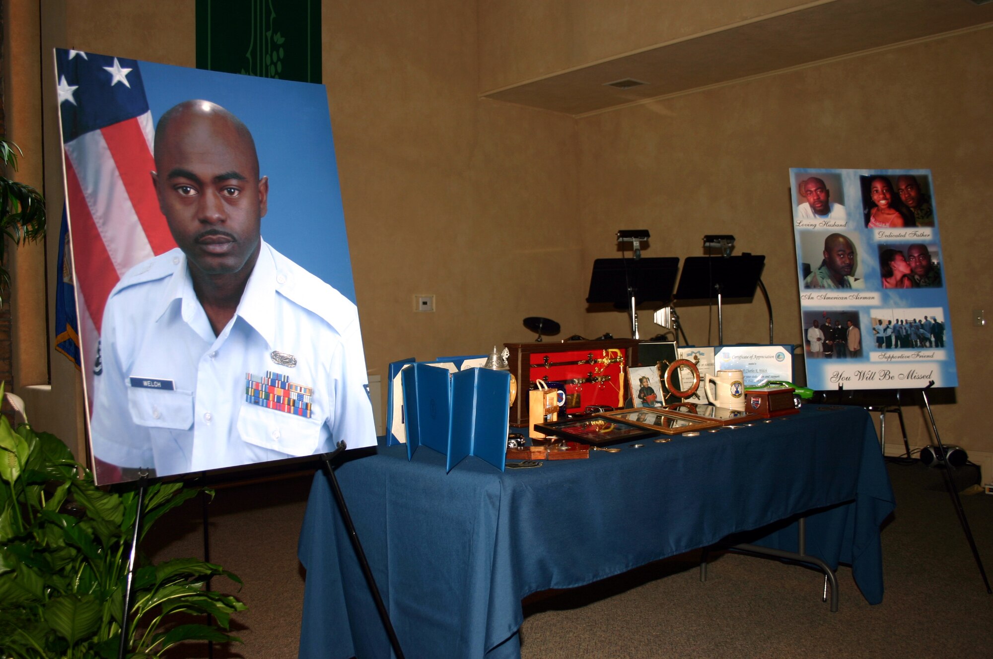 Photographs and personal belongings of 882nd Training Support Squadron Staff Sgt. Charles Welch serve as a tribute to the fallen Airman in a memorial service at the North Chapel Sept. 20.  Sergeant Welch died from injuries sustained in a one-vehicle accident. (U.S. Air Force photo/Staff Sgt. Tonnette Thompson)
