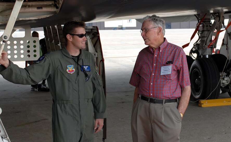 WHITEMAN AIR FORCE BASE, Mo. -- Capt. Justin Grieve, 13th Bomb Squadron pilot, talks to former Capt. Charlie Taylor, a World War II veteran, during a tour of the base Sept 20. Captain Taylor, a B-24 Liberator pilot, and more than 100 of his fellow veterans visited the base as part of a reunion for the 485th Bomb Group. (U.S. Air Force photo/Staff Sgt. Charles Larkin)