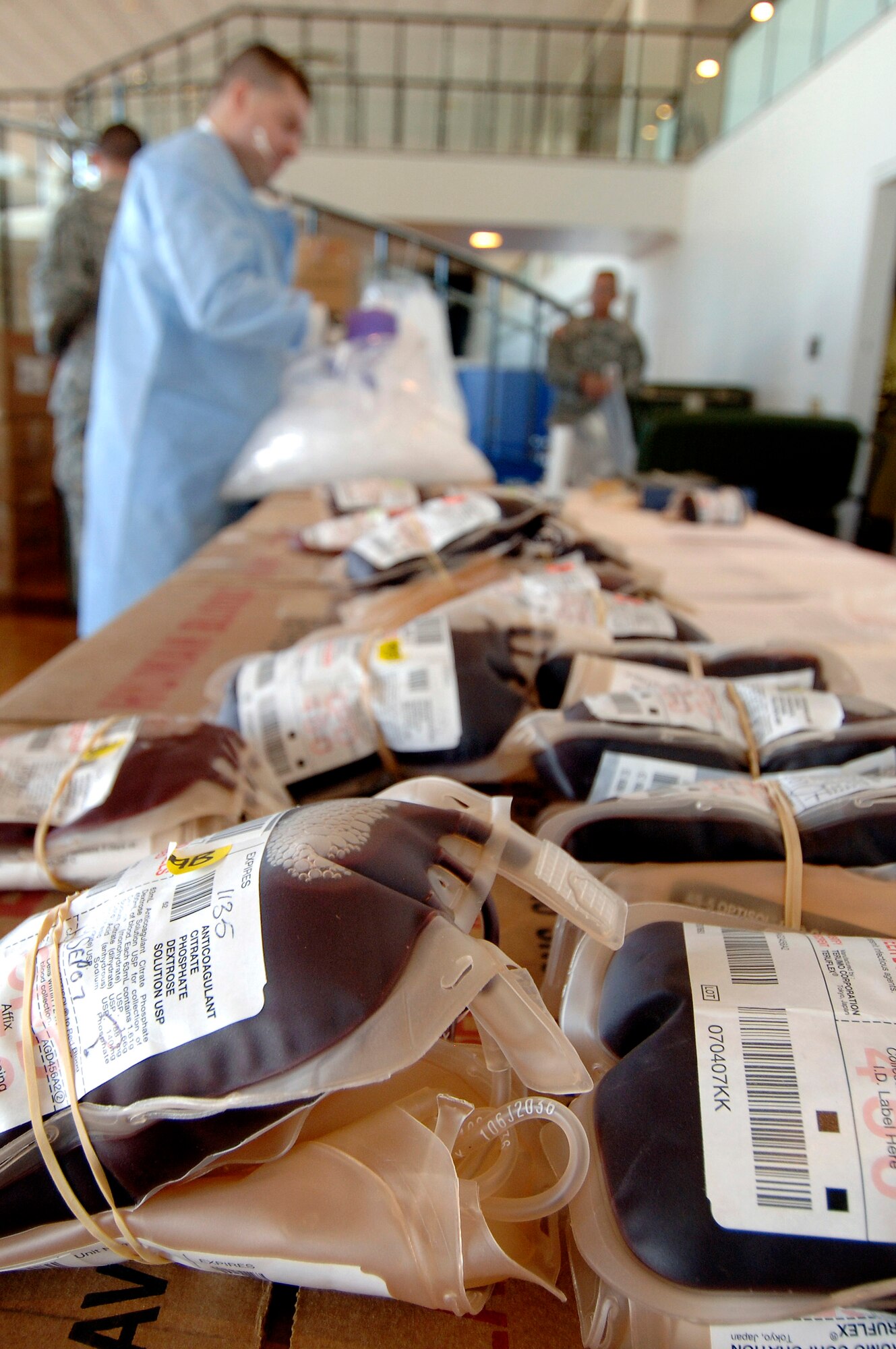 Army Spc. Benjamin Miller of Fort Bliss, Texas, processes blood donated during a blood drive held in the Arnold Hall ballroom Sept. 19 at the U.S. Air Force Academy in Colorado. Blood collected will benefit armed forces members by helping to meet the urgent needs of wounded Americans in Iraq and Afghanistan. (U.S. Air Force photo/Mike Kaplan) 
