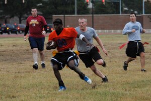 LANGLEY AIR FORCE BASE, Va -- Gregory Smoots of the 27th Intelligence Squadron scrambles and runs the ball for a touchdown against the 497th Intelligence Group Sept. 20. The 480th IW won by the match 14-0. (U.S. Air Force photo/Airman 1st Class Aaron Johnson)