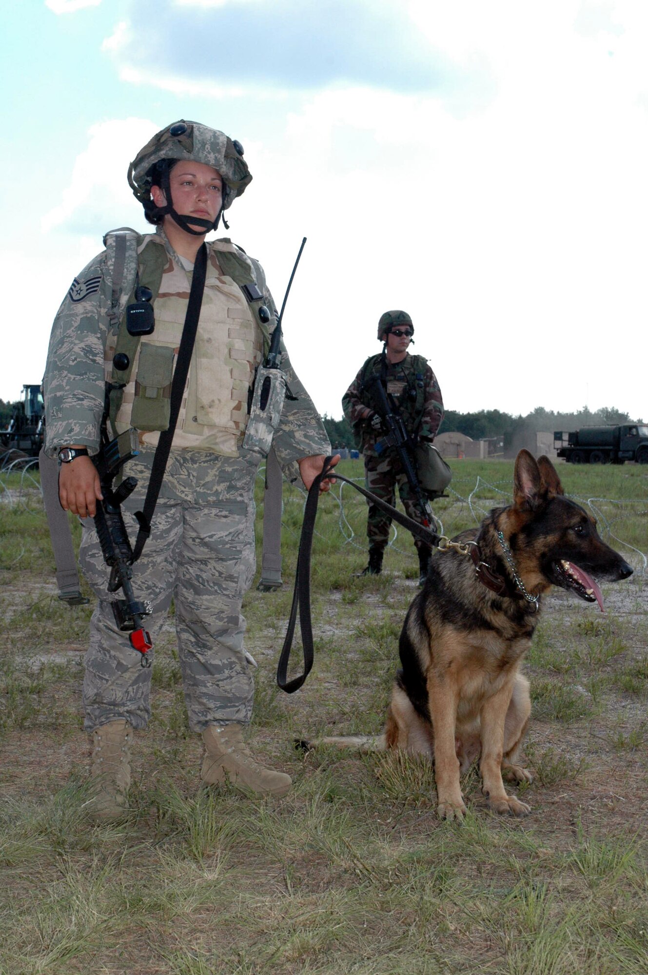 Staff Sgt. Pamela Lowande and her military working dog Ziko, both from the 81st Security Forces Squadron at Keesler Air Force Base, Miss., participate in a scenario for Air Force Exercise Eagle Flag 07-6 on Aug. 28 at Naval Air Engineering Station Lakehurst, N.J.  Sergeant Lowande and Ziko were Phoenix Warrior 07-6 students participating in the exercise.  The exercise is operated by the U.S. Air Force Expeditionary Center's 421st Combat Training Squadron from Fort Dix, N.J.  (U.S. Air Force Photo/Tech. Sgt. Scott T. Sturkol)