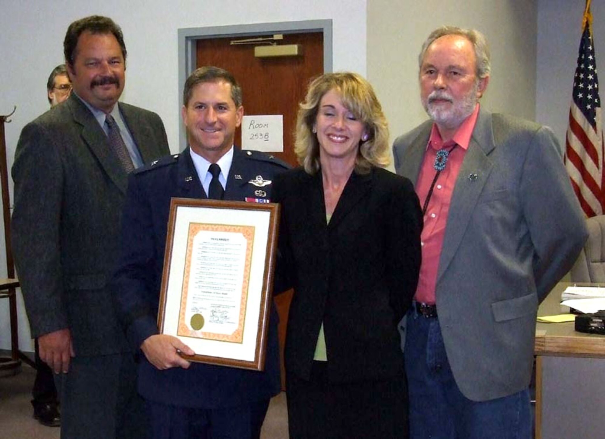 Mr. Doug Moore, chairman of the Otero County Board of Commissioners, Ms. Clarissa McGinn, vice-chairperson of the Otero County Board of Commissioners and Mr. Michael Nivison, member of the Otero Coutny Board of Commissioners, give Brig. Gen. David Goldfein, 49th Fighter Wing commander, a proclamation. The proclamation recognizes September 2007 as Air force Month in Otero County. (U.S. Air Force photo/Mr. Rob Sexton)