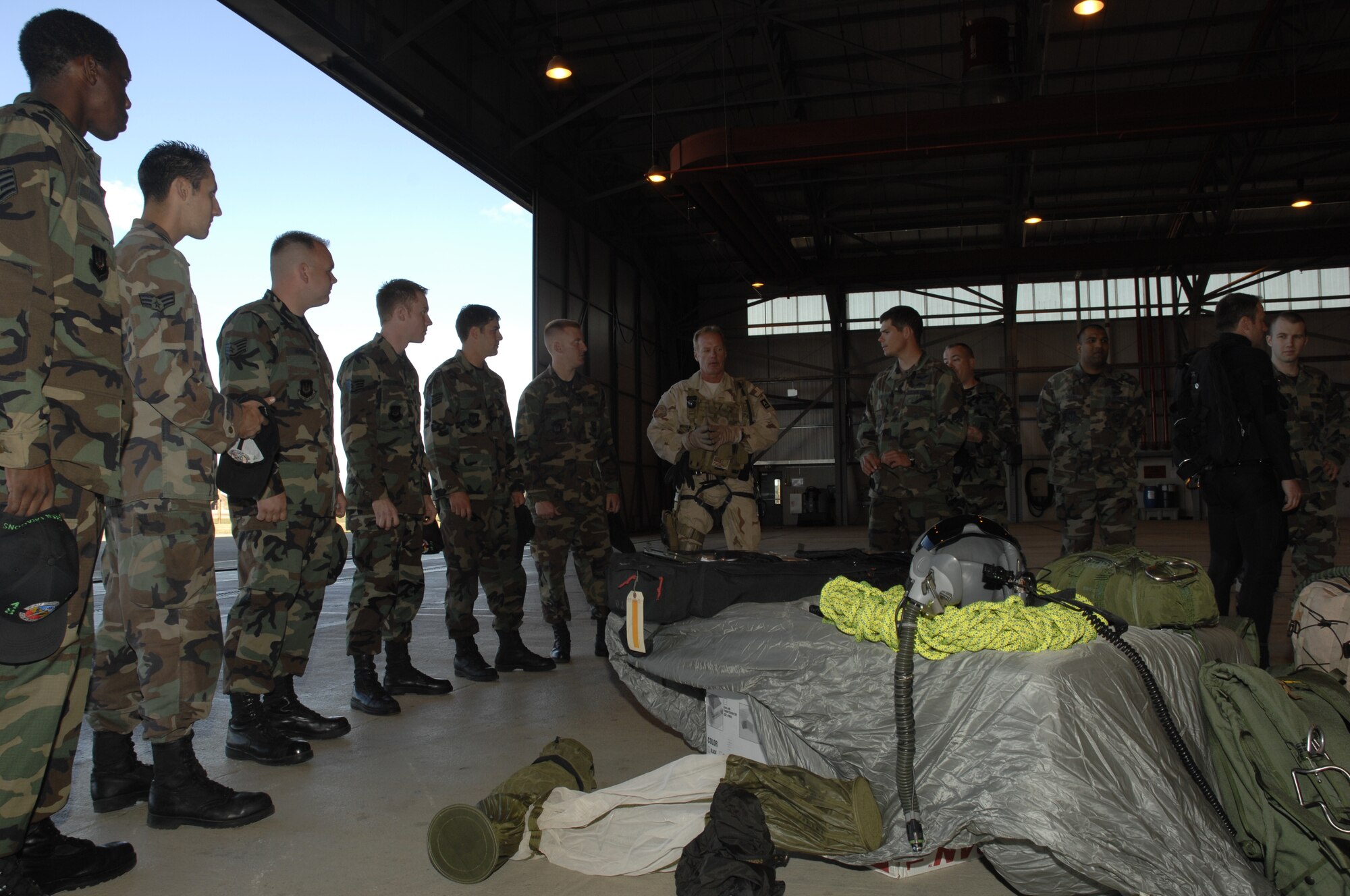 Tech. Sgt. Michael Gray, 56th Rescue, Squadron at RAF Lakenheath explains displays of equipment and how the squadron uses them Sept.18. Pararescuemen, such as Sergeant Gray, fill many rolls such as paramedics, scuba divers, mountain climbers, small arms experts, operate terrain vehicles and much more. (U.S. Air Force photo by Airman 1st Class Jessica Snow)
