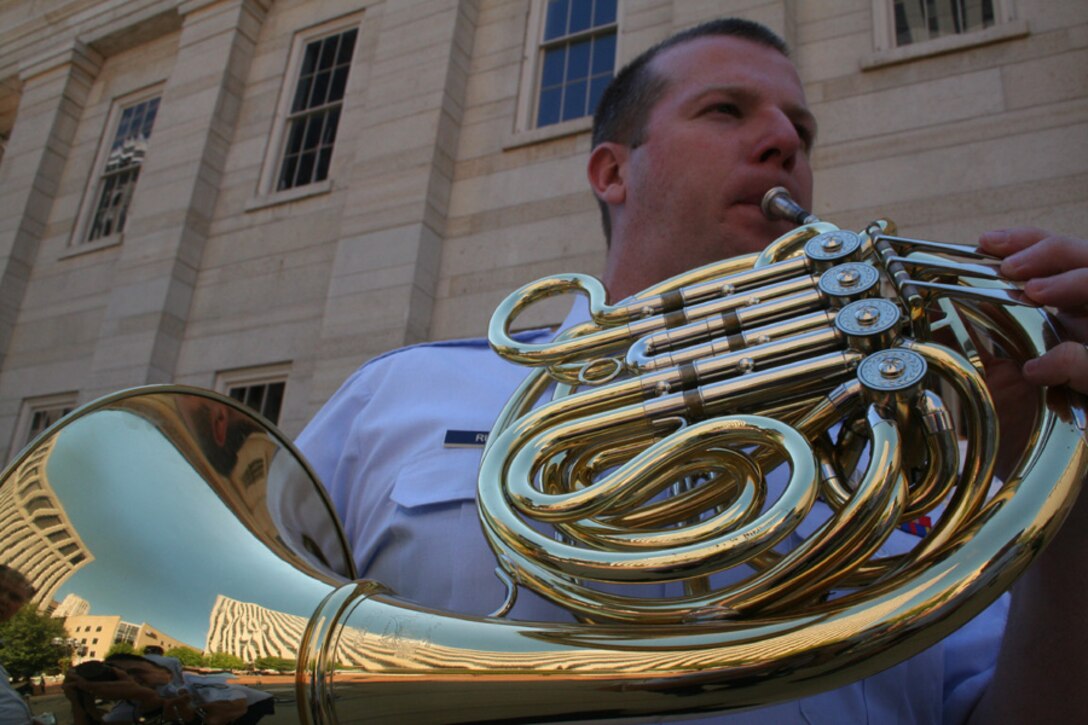Senior Airman VJ Russell performs during Tunes at Noon in Downtown Dayton, Ohio.  SrA Russell is a member of Wright Brass.