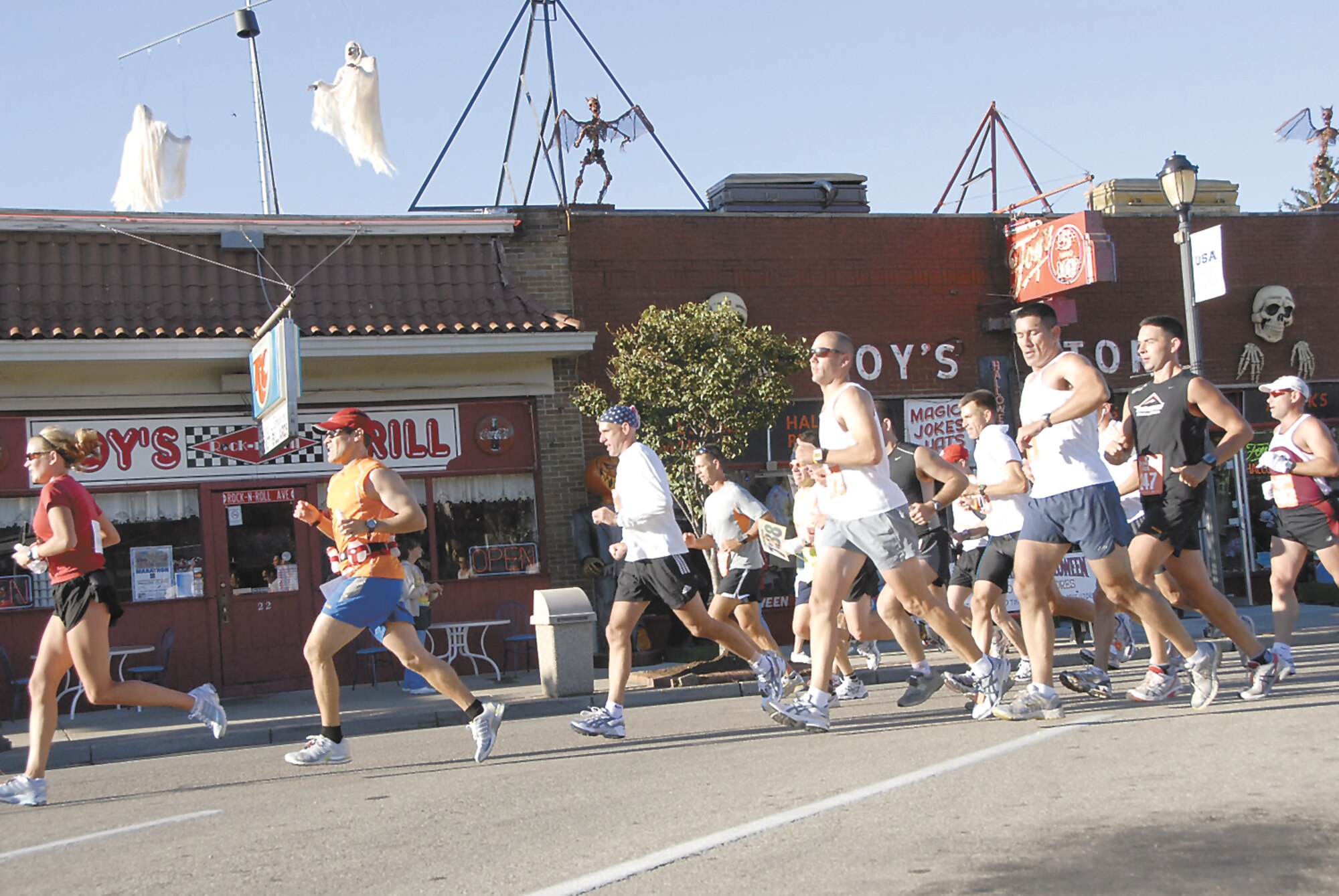This year's marathon route took the runners through the streets of downtown Fairborn. Along the way runners got a glimpse of a favorite Fairborn landmark, Foy's Store. Skywrighter photo by Christy Webb.