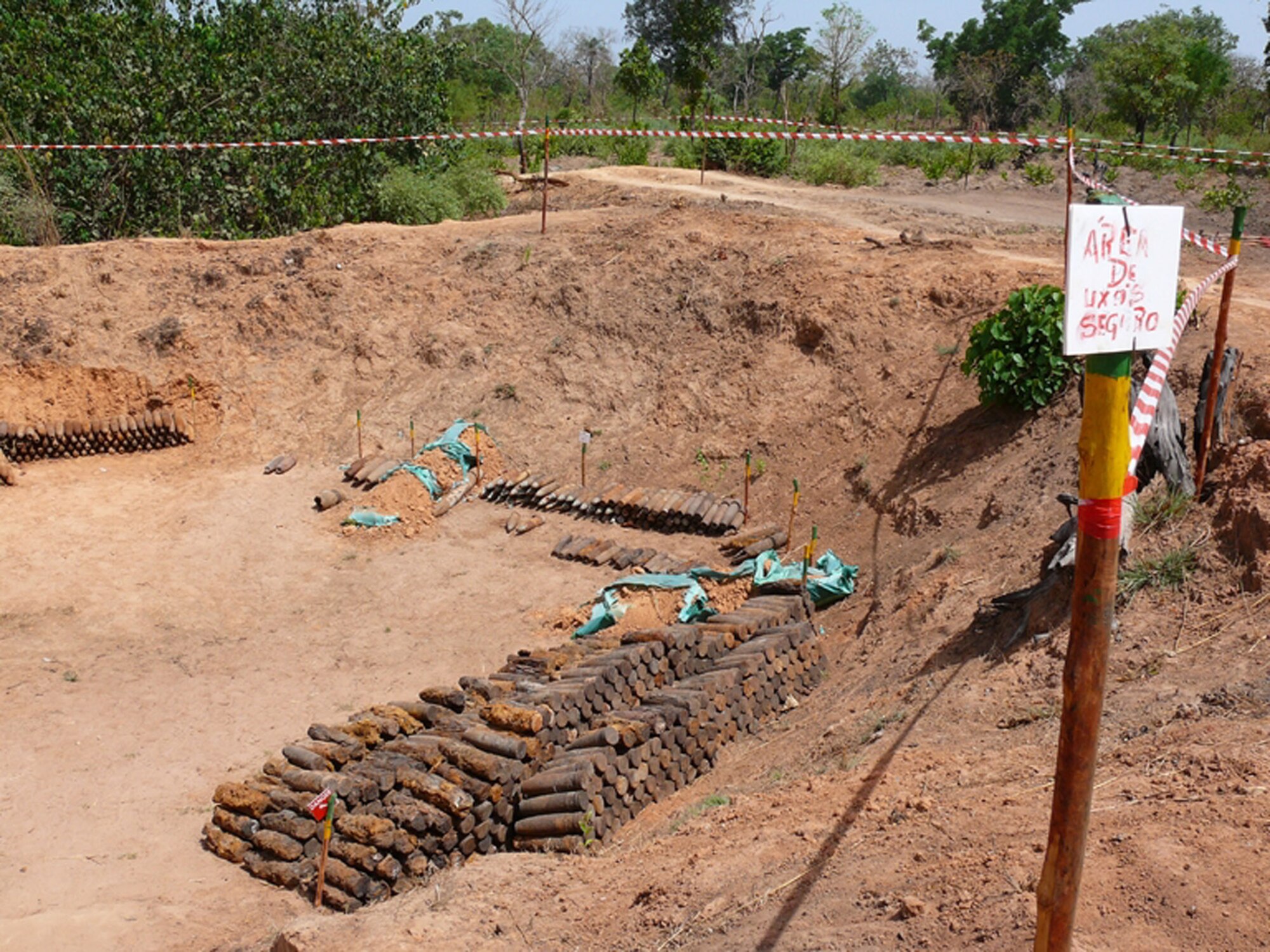 SPANGDAHLEM AIR BASE, Germany – A stack of unexploded ordinance sits in a holding pit awaiting destruction, in Guinea-Bissau, West Africa. A team of 10 Airmen deployed there to provide local de-miners in battle area clearance and unexploded ordnance demolition. (U.S. Air Force photo/Master Sgt.  Rodger Cowart) 