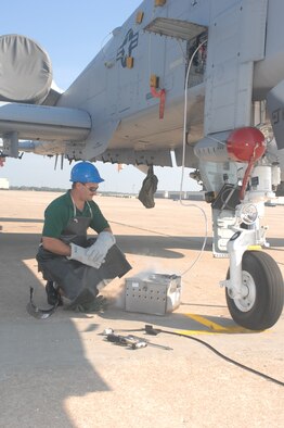 WHITEMAN AIR FORCE BASE, Mo. -- Tech. Sgt. Adam Martin, 442d Aircraft Maintenance Squadron, purges the liquid oxygen system on A-10 aircraft Sept. 17. The system provides oxygen for the pilot to prevent hypoxia or oxygen starvation. (U.S. Air Force photo/Tech. Sgt. Samuel A. Park) 