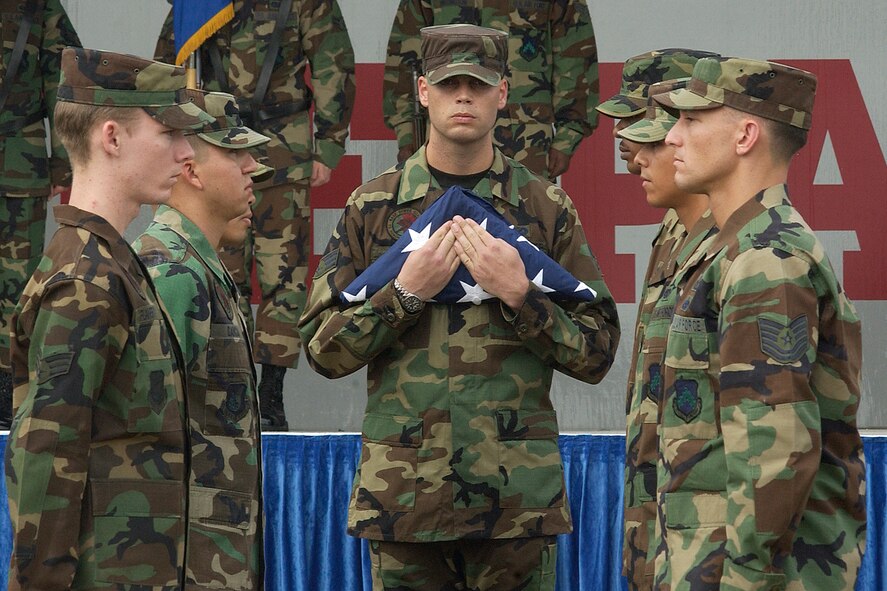 KUNSAN AIR BASE, South Korea – The American Flag is folded by members of the 8th Fighter Wing, during the POW/MIA ceremony held here Sept. 21. (U.S. Air Force photo/Senior Airman Giang Nguyen)