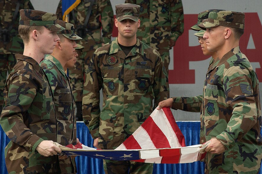 KUNSAN AIR BASE, South Korea – The American Flag is folded by members of the 8th Fighter Wing, during the POW/MIA ceremony held here Sept. 21. (U.S. Air Force photo/Senior Airman Giang Nguyen)