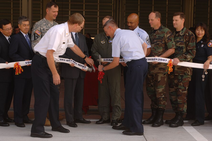 YOKOTA AIR BASE, Japan-- Colonel John Newell Commander of the 374th Airlift Wing performs a ribbion cutting ceremony for the new 374th Civil Engineering Squadrons fire station on September 20, 2007. (U.S. Air Force photo by Airman 1st Class Laszlo Babocsi)(Released)