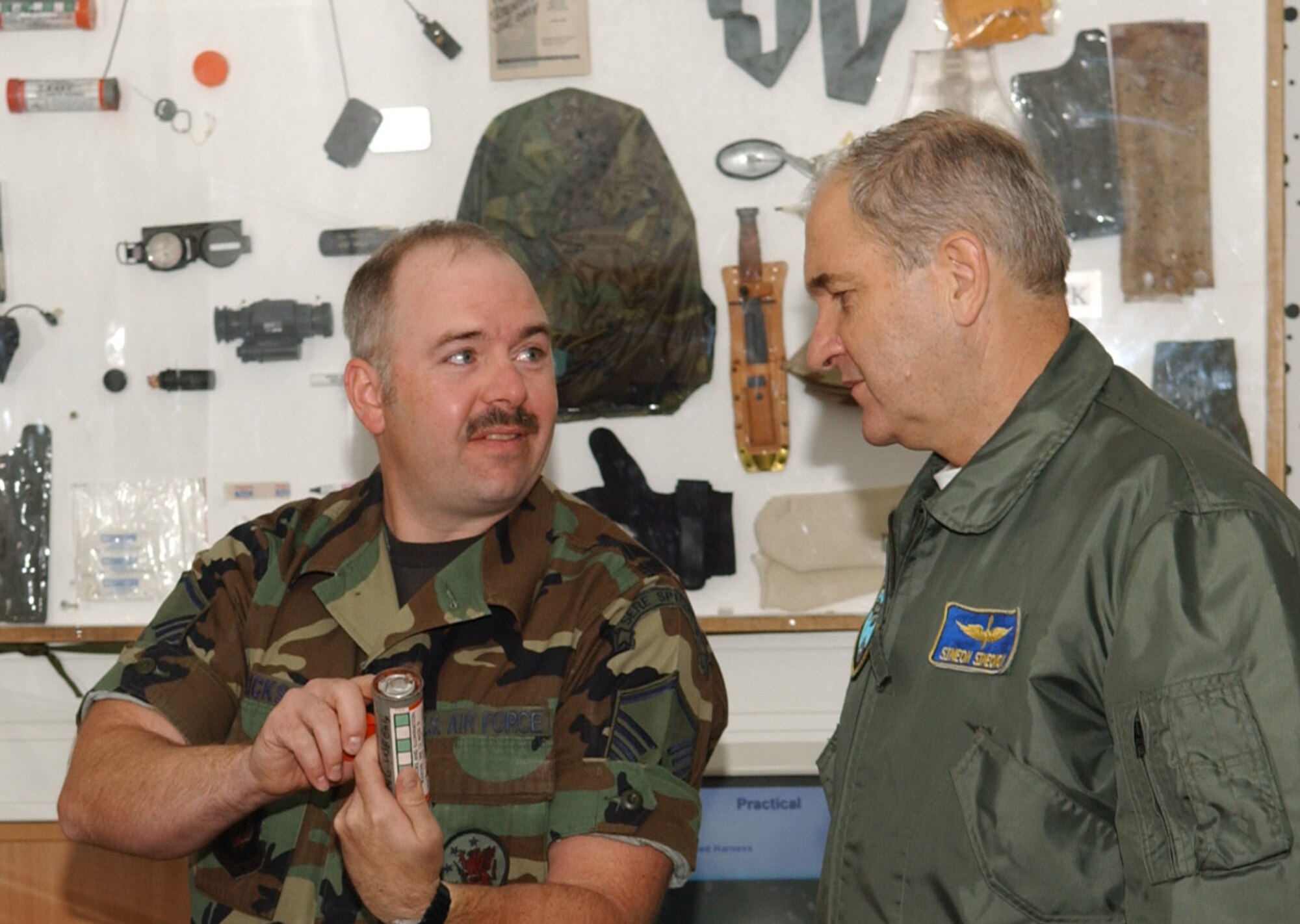 SPANGDAHLEM AIR BASE, Germany – Master Sgt. Tod Erickson, 52nd Operations Support Squadron, shows Lt. Gen. Simeon Hristov Simeonov, Bulgarian air force commander, how to differentiate between the smoke and flare end of an MK-13 flare Sept. 19, 2007. The flares are used for search and rescue operations in the event that a mishap occurs during flight. (U.S. Air Force photo/Airman 1st Class Allen Pollard) 