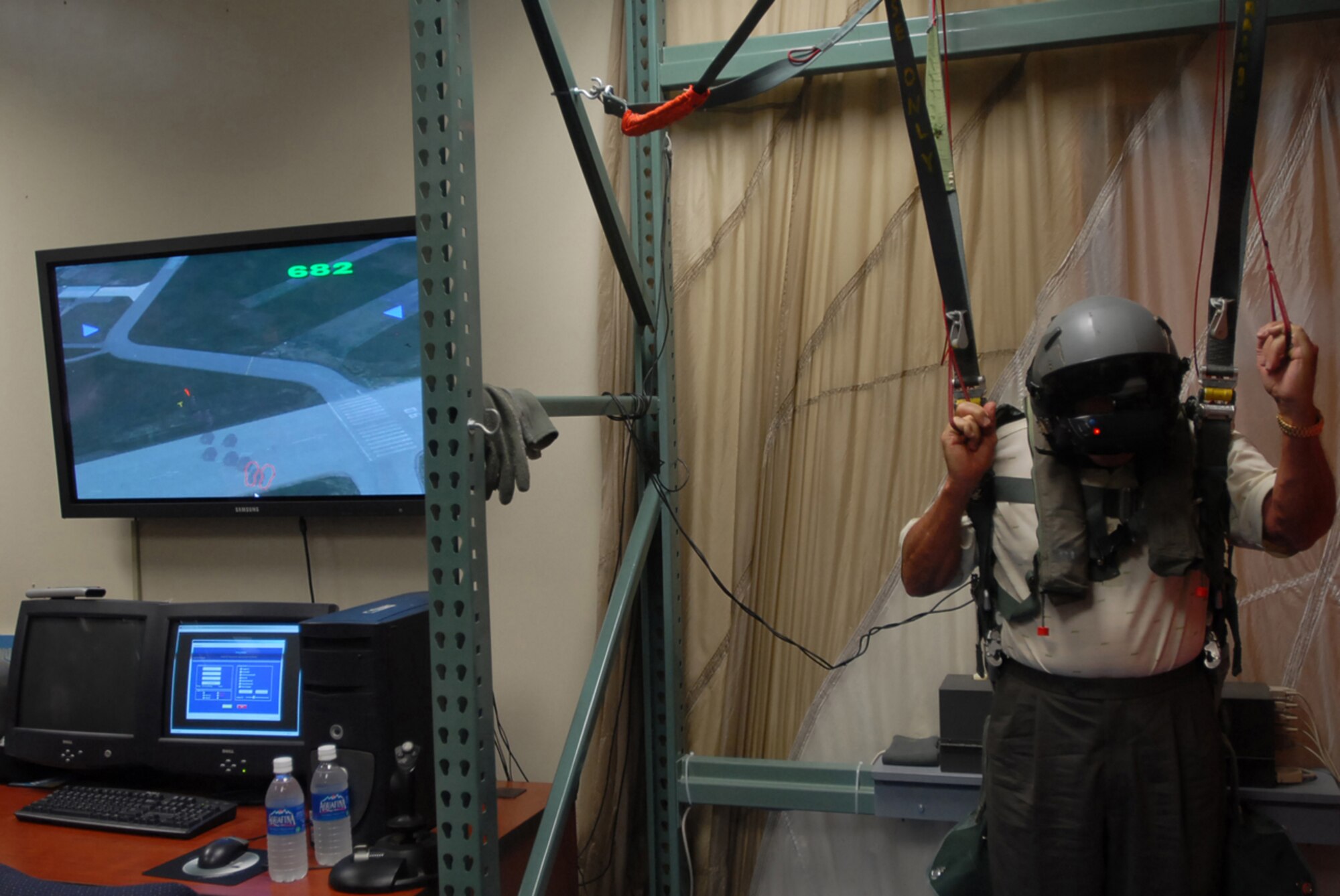 Col. (ret.) and former Prisoner of War Jim Lamar uses the parachute simulator during his egress training at Kadnea Air Base, Japan, Sept. 20, 2007. Mr. Lamar was a POW during Vietnam and will be speaking at the base's POW/MIA ceremony Sept. 21.  After the ceremony, Mr. Lamar will receive an F-15C Eagle orientation flight. (U.S. Air Force photo/Senior Airman Darnell T. Cannady)