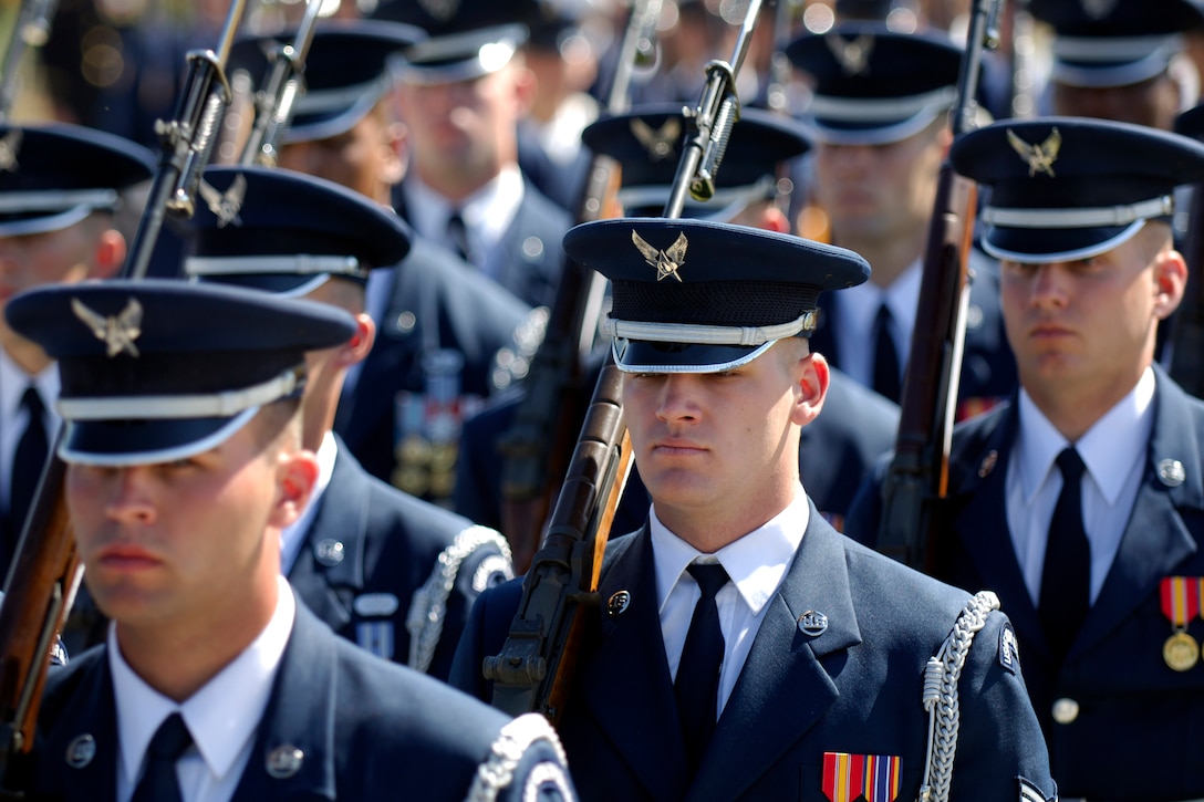 U.S. Air Force members of the Joint Services Color Guard march in ...