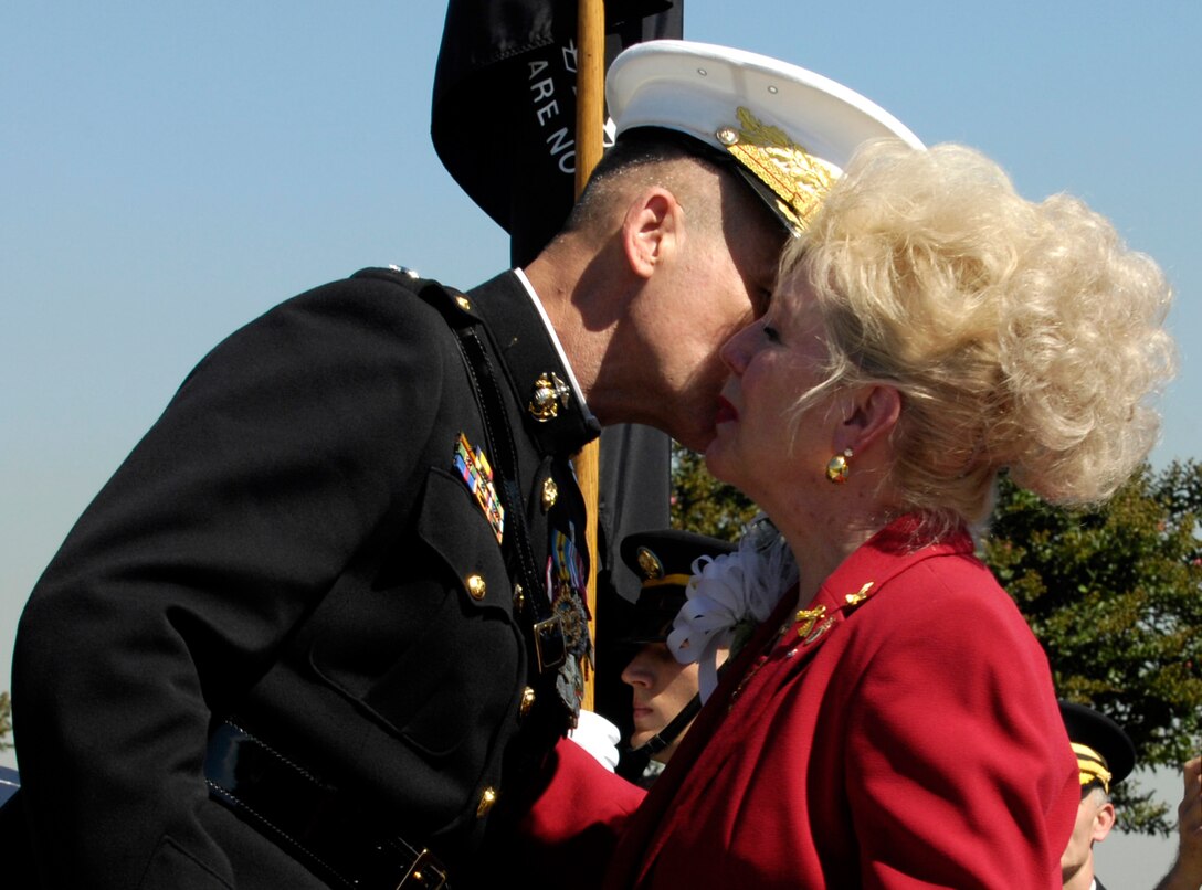 Chairman of the Joint Chiefs of Staff U.S. Marine Gen. Peter Pace kisses Patricia Scharf, widow of Col. Charles Scharf, on the cheek during a POW/MIA Recognition Day ceremony at the Pentagon, Sept. 21, 2007.  The colonel, an F-4C Phantom II pilot, was shot down over Vietnam, Oct. 1, 1965.  Fragments of Scharf's remains were identified last year using DNA from love letters he had sent to his wife.  