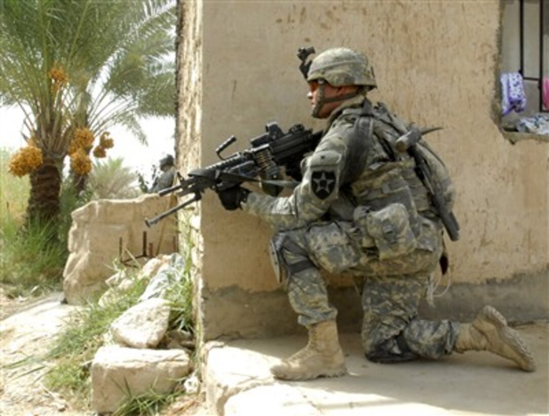 A U.S. Army soldier from Charlie Company, 4th Battalion, 9th Infantry Regiment provides security during a raid on a suspected insurgent's house in Tarmiyah, Iraq, on Sept. 8, 2007.  