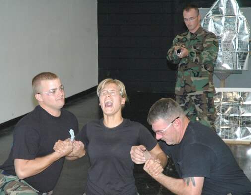 Senior Airman Riley Marx, 90th Security Forces Squadron, volunteers to feel the effects of being tased during a Taser instruction course Aug. 21 (Photos by Airman Alex Martinez).