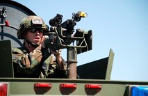 Airman 1st Class Chad Hughes, 790th Missile Security Forces Squadron, positions his weapon on top of a Bearcat to aim at members of the simulated terrorist force. The convoy crew stopped the simulated terrorist attack in two exercises Aug. 28 at a non-operational launch facility (Photos by Airman 1st Class Daryl Knee).