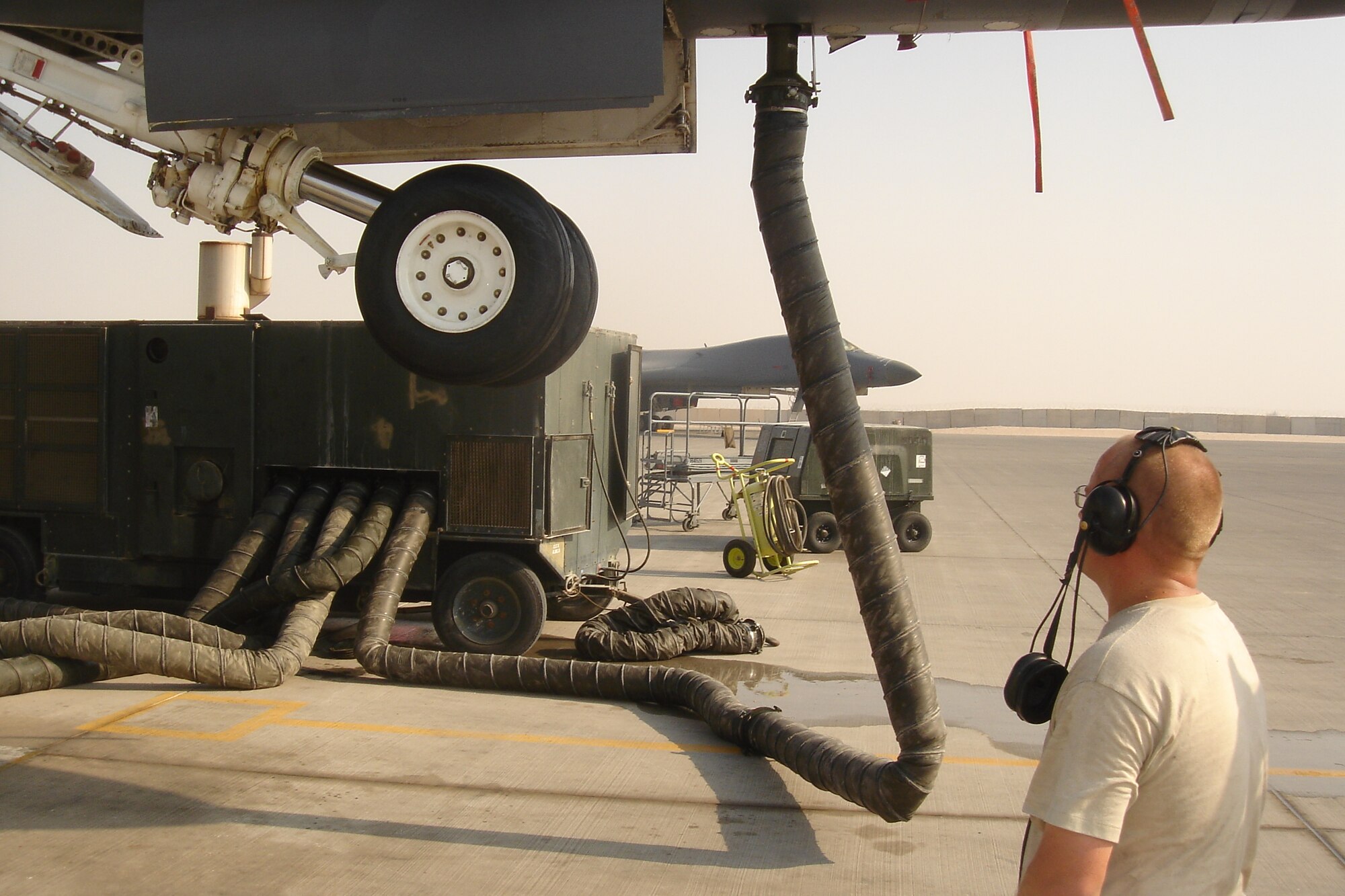 SOUTHWEST ASIA -- Tech. Sgt. Eric Nelson, 379th Expeditionary Aircraft Maintenance Squadron,, supervises the operational check of  a B-1 Lancer’s nose gear upon completion of major repairs. (U.S. Air Force photo/Lt. Col. Scott Fike)