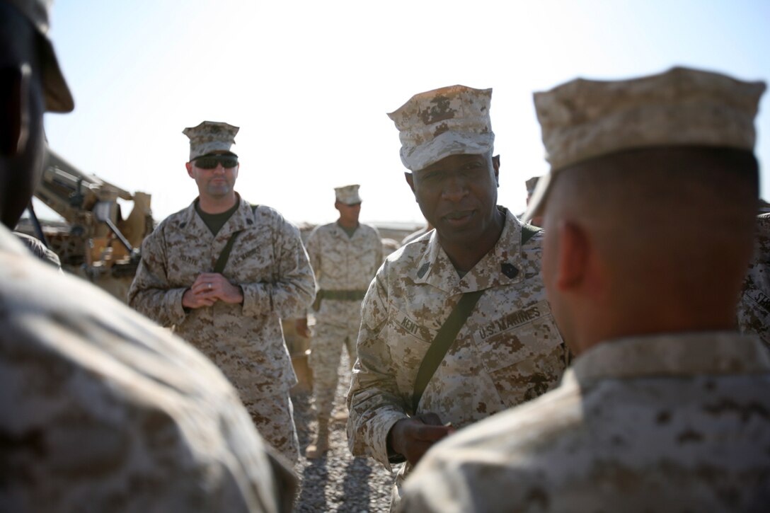 Sgt. Maj. of the Marine Corps Carlton W. Kent, the Corps' senior enlisted man, speaks to the crew of an M198 medium towed howitzer aboard Camp Fallujah, Iraq, September 23. The Marines with Battery T, 5th Battalion, 10th Marine Regiment, Regimental Combat Team 6, were visited by the top enlisted Marine in his first trip back to the area of operations since his appointment to his post Apr. 25, 2007. Among the things Kent discussed with his Marines were retention of first-term Marines, adjustments to the Body Composition Program and the updating of the physical training uniform.