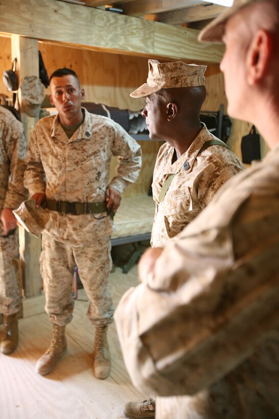 Sgt. Maj. of the Marine Corps Carlton W. Kent talks with the enlisted leadership of Battery T, 5th Battalion, 10th Marine Regiment, Regimental Combat Team 6, about their newly-established living spaces at the artillery "gun line" aboard Camp Fallujah, Iraq. Kent, who was formerly a battery first sergeant for an artillery battery aboard the camp, said he was pleased to see that living conditions were improving for the Marine canoneers. Kent was in the area to visit the Marines currently serving with Multi-National Forces-West, the Marine command responsible for Anbar Province, Iraq.