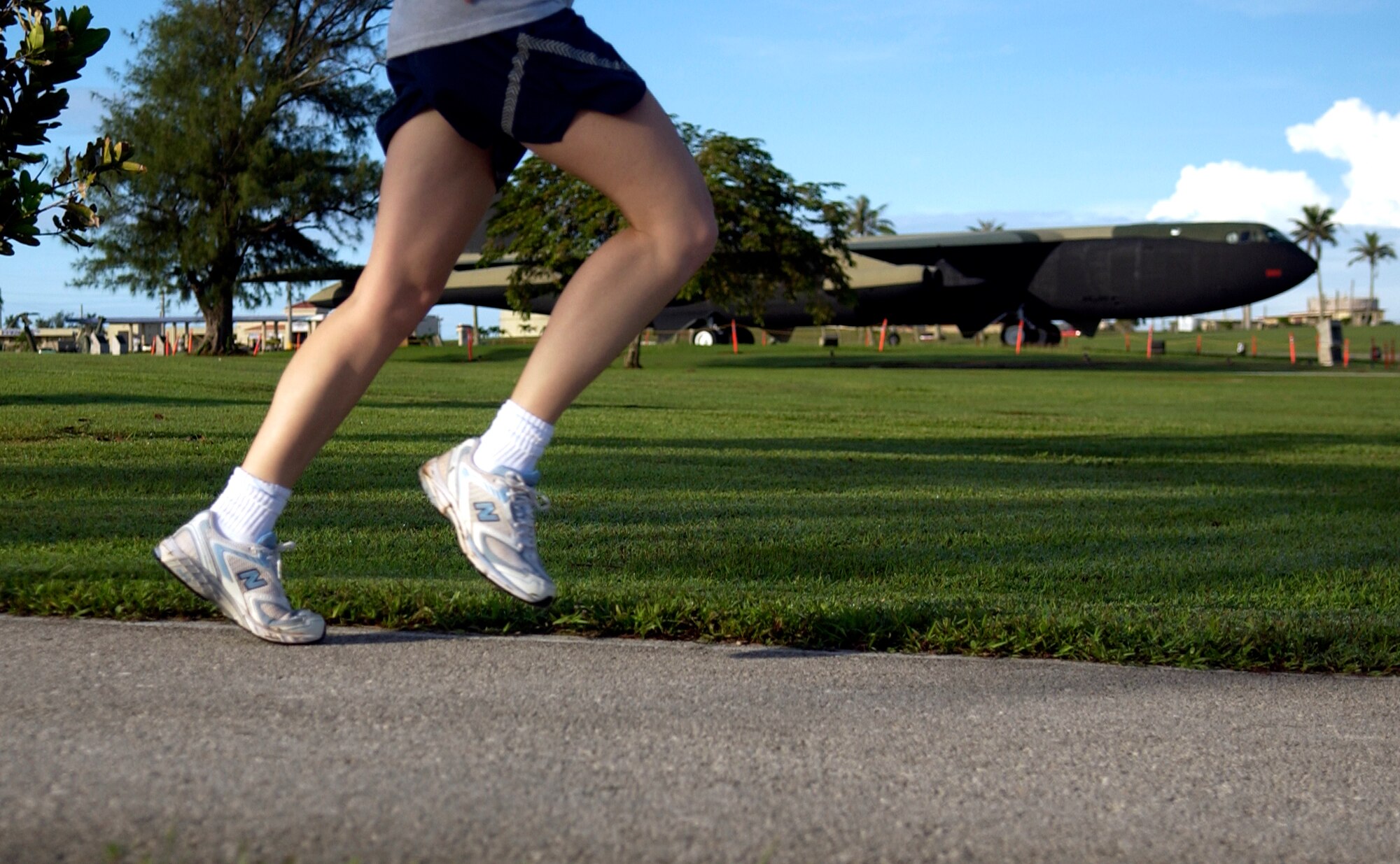 An airman runs around the Arc Light Memorial during the Prisoner of War and Missing in Action Run, Sept. 21, 2007. Squadrons base-wide participated in the 24-hour run on POW/MIA Recognition Day. (U.S. Air Force photo/Senior Airman Miranda Moorer)                                        
