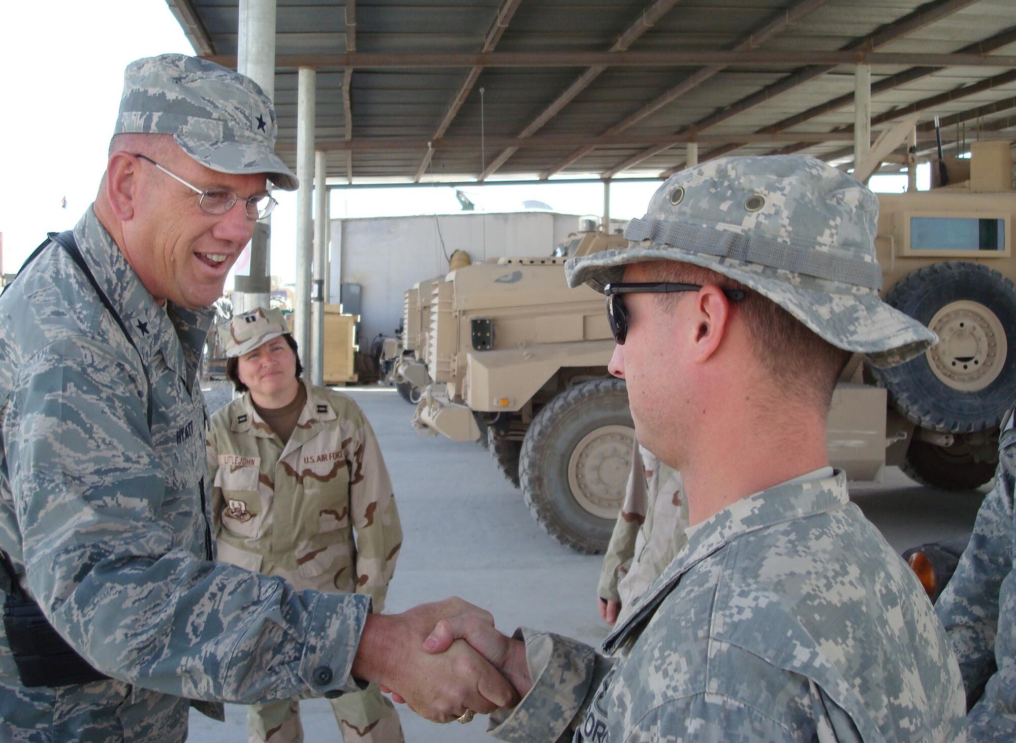 QALAT, Afghanistan - Air Force Brig. Gen. James Hyatt, the 455th Air Expeditionary Wing commander, thanks Airmen assigned to the Qalat Provincial Reconstruction Team Sept. 22.  PRTs assess humanitarian needs, implement small reconstruction projects and established relations with the United Nations Assistance Mission in Afghanistan and nongovernmental organizations already in the field. (U.S. Air Force Photo by Capt Robert Everdeen)
