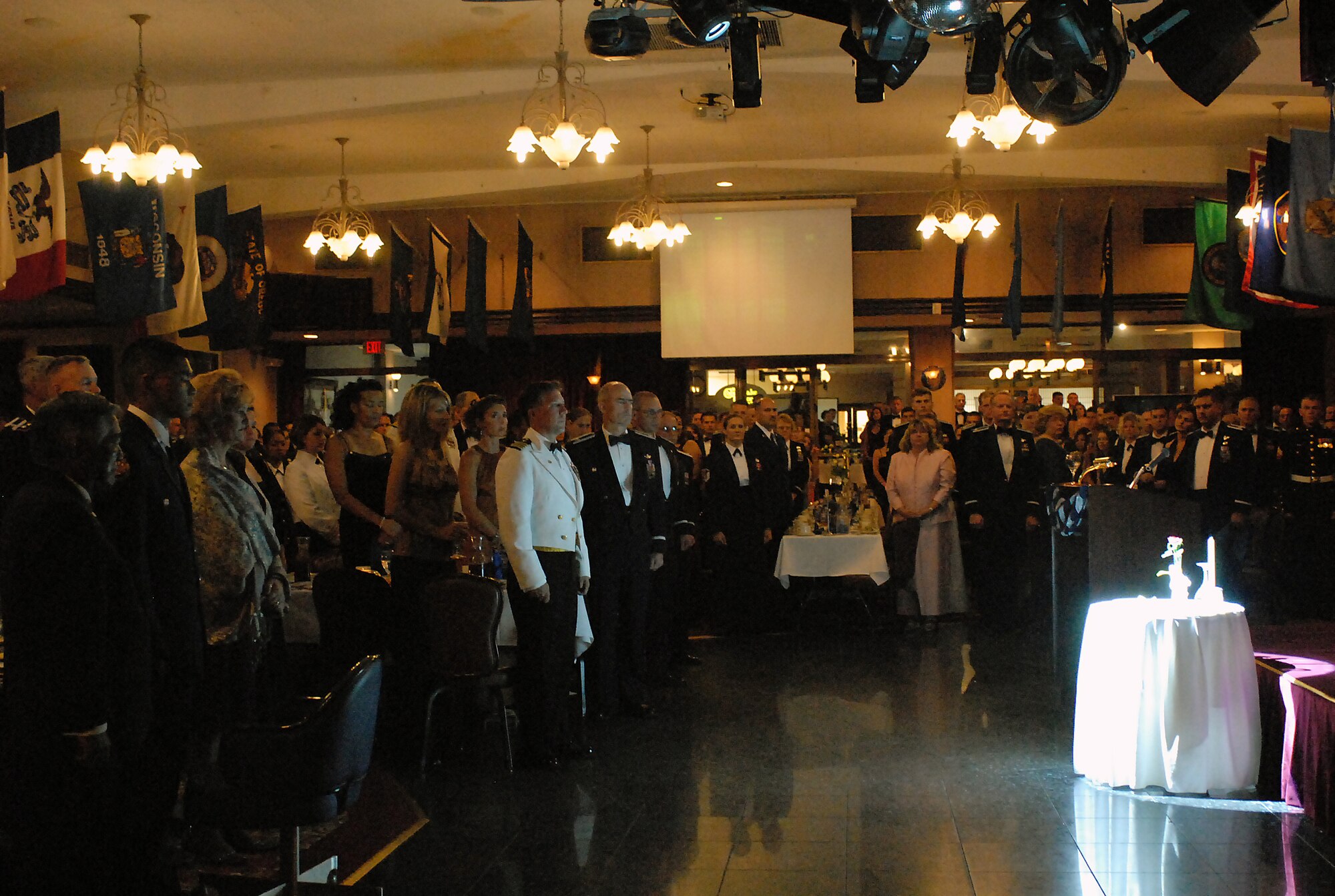 Military members and their guests pay respects to fallen service members during the Air Force's 60th Anniversary Ball at Kadena Air Base, Japan, Sept. 22, 2007.  The evening consisted of toasts, video presentations, guest speakers, skits and live music.  More than 800 military members and their guests from all four services, the local community and Japanese Self Defense Force attended the annual event.  (U.S. Air Force photo/Airman 1st Class Kelly Timney)