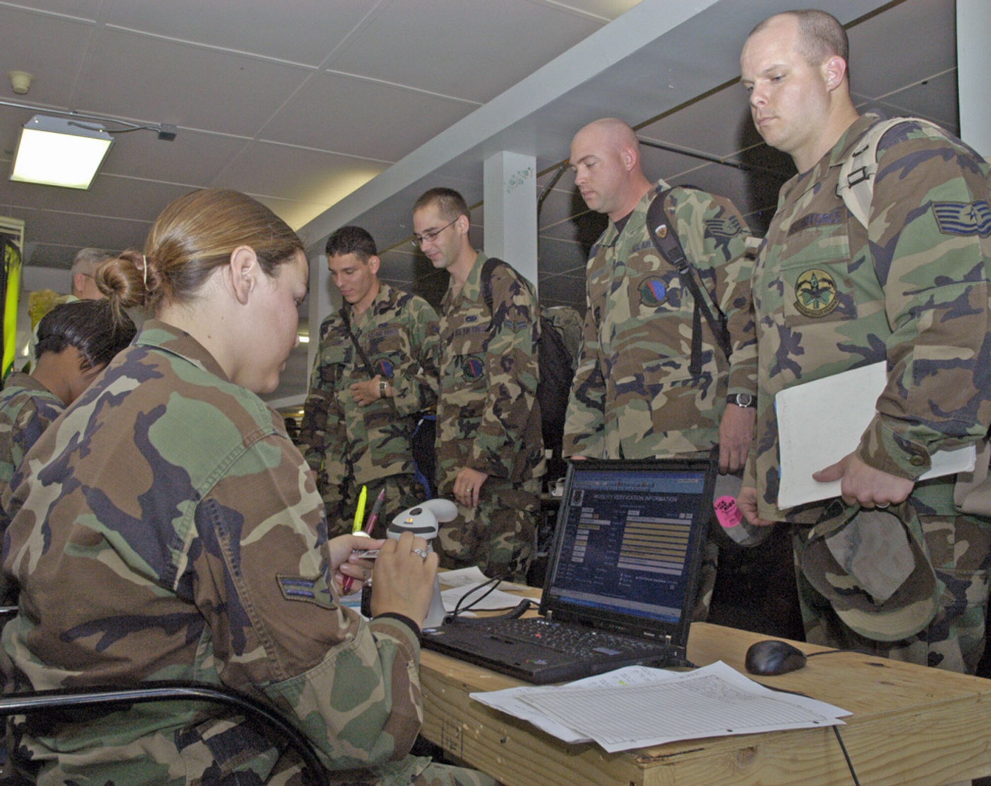 Airmen process through the exercise phase I deployment line at Bldg. 313 Sept. 13. As part of the operational readiness inspection, Warren had to show that it was capable of preparing to deploy personnel in an air expeditionary force bucket (Photo by 2nd Lt. Lisa Meiman).